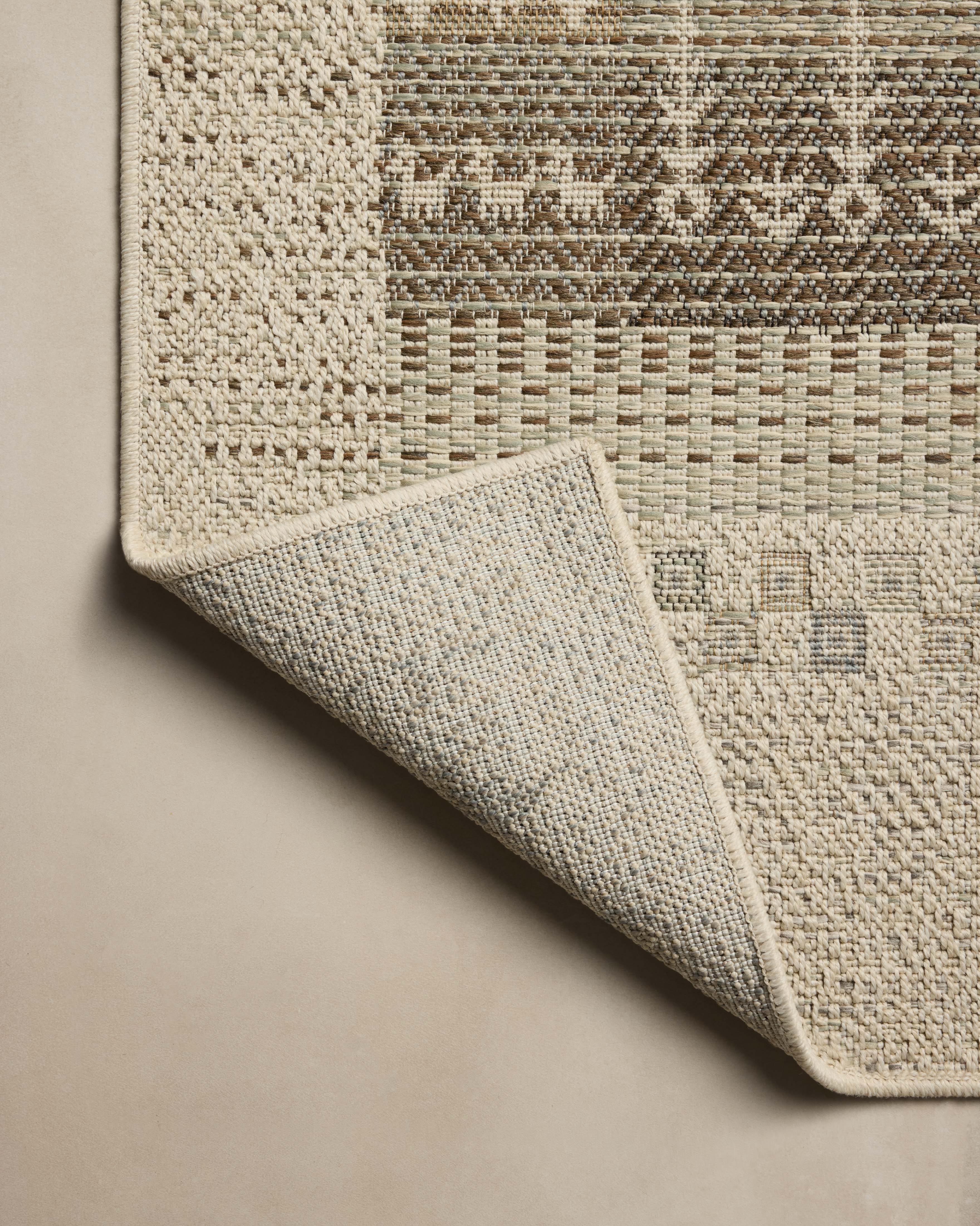 A power-loomed polypropylene area rug with refined ivory and earthy tones, the Saylor SAY-05 Ivory / Earth Area Rug adds character to any room