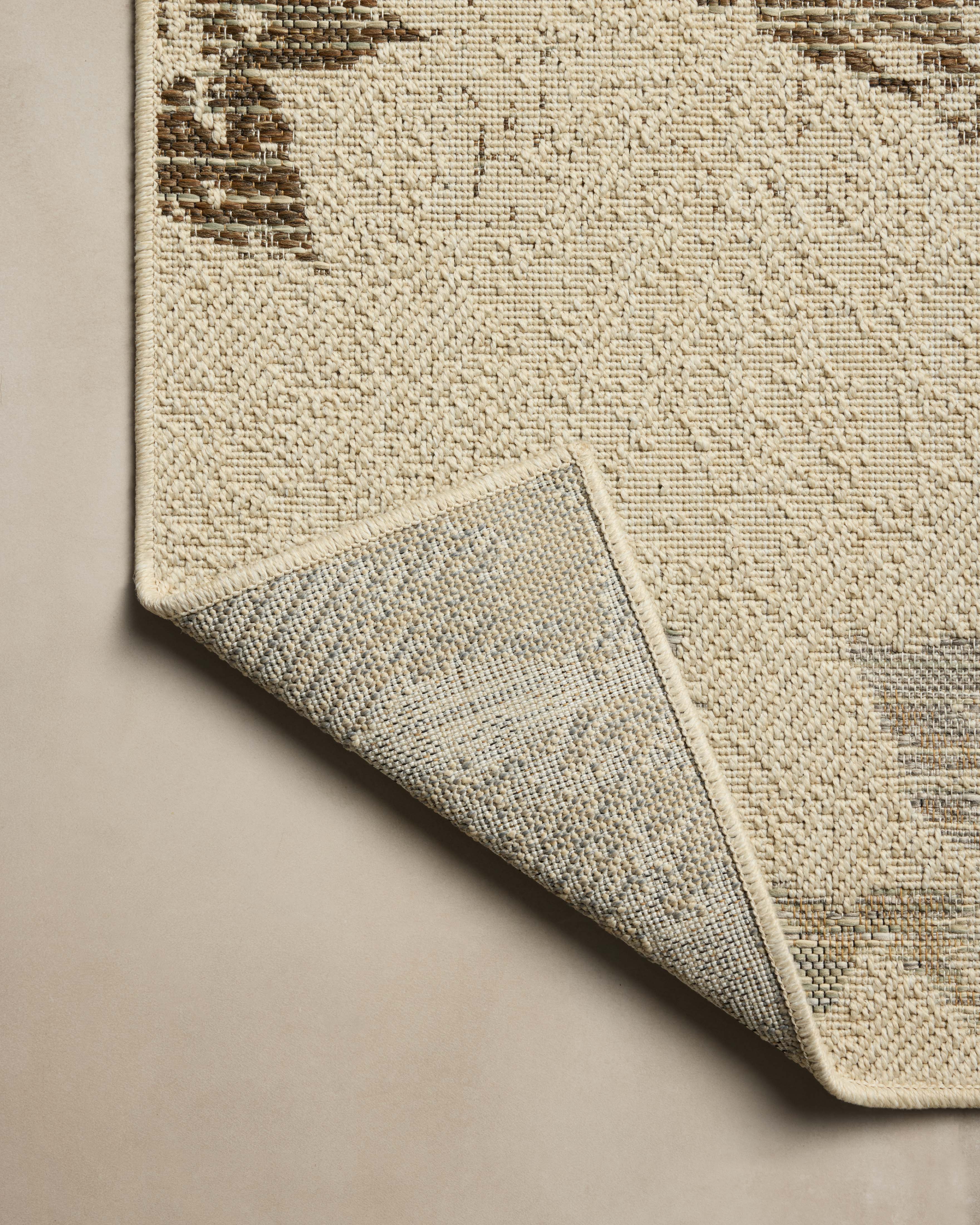 Rich in refined ivory and grounded bark hues, the Saylor SAY-06 Ivory / Bark Area Rug is a power-loomed polypropylene area rug built for style and comfort