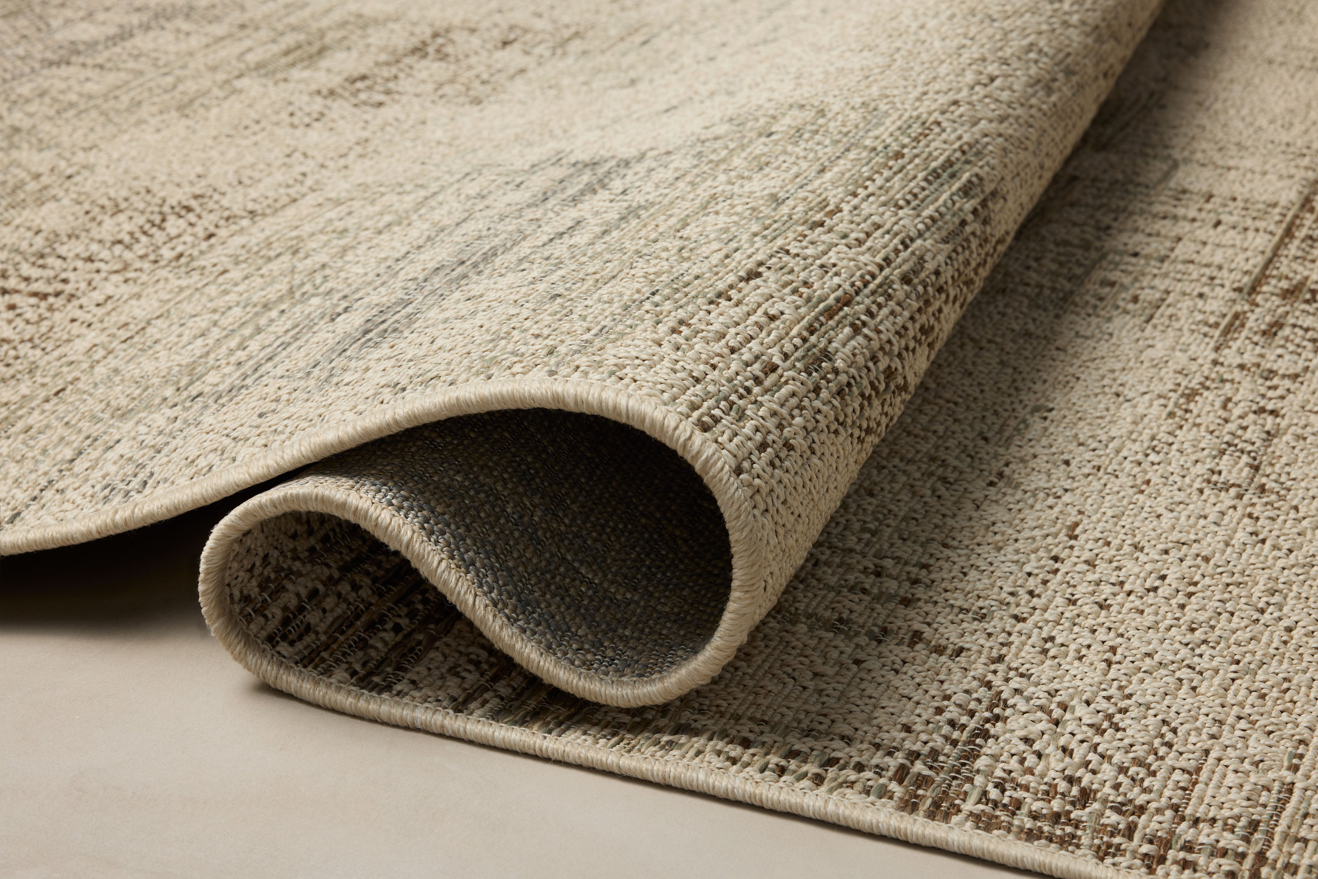 The Saylor SAY-07 Ivory / Fog Area Rug offers refined ivory and misty sophistication in a power-loomed polypropylene area rug