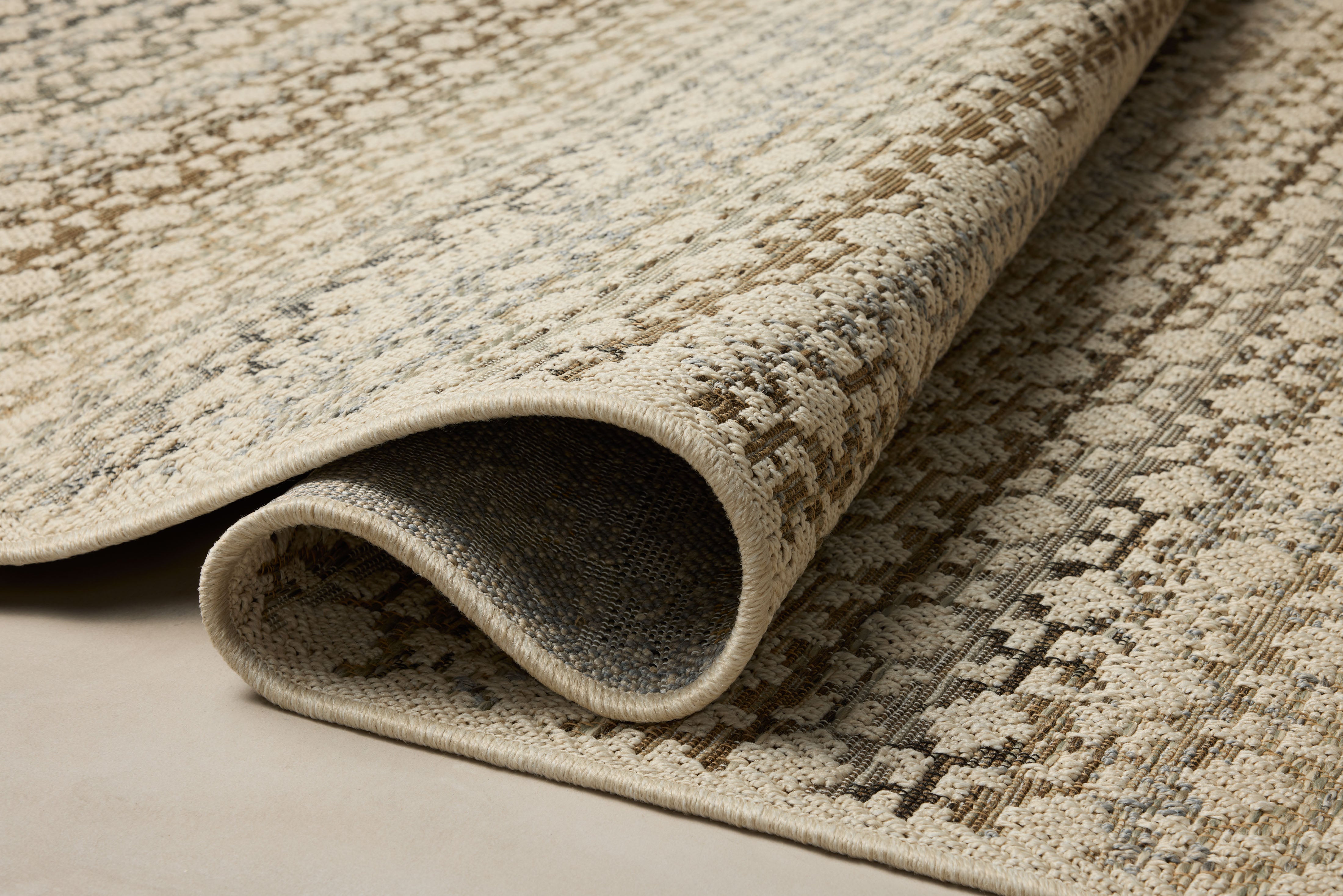 The Saylor SAY-09 Ivory / Multi Area Rug brings refined ivory and vibrant multi-toned character to your home in a power-loomed polypropylene area rug