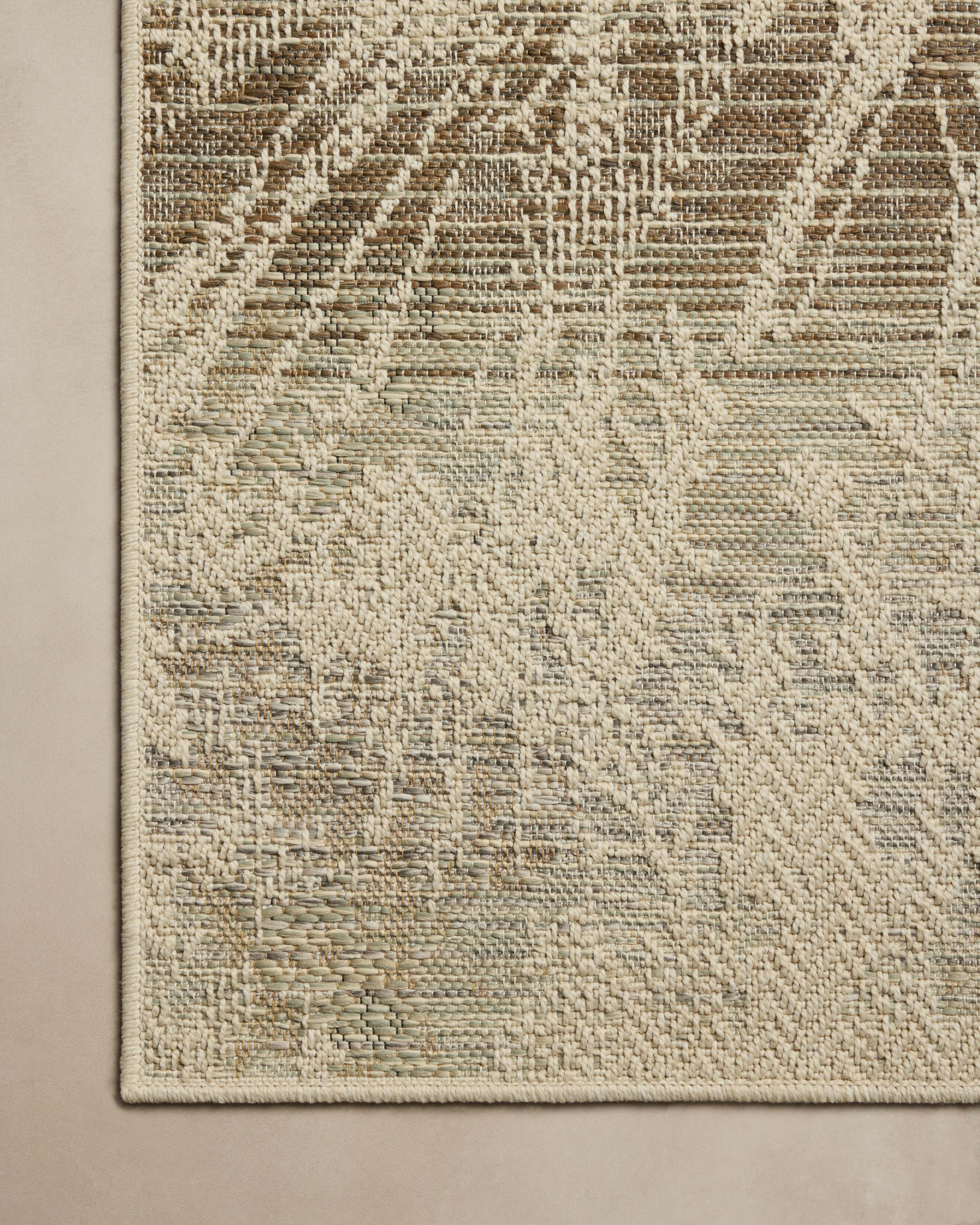 Finished in refined ivory and grounding stone tones, the Saylor SAY-10 Ivory / Stone Area Rug is a power-loomed polypropylene area rug for modern living