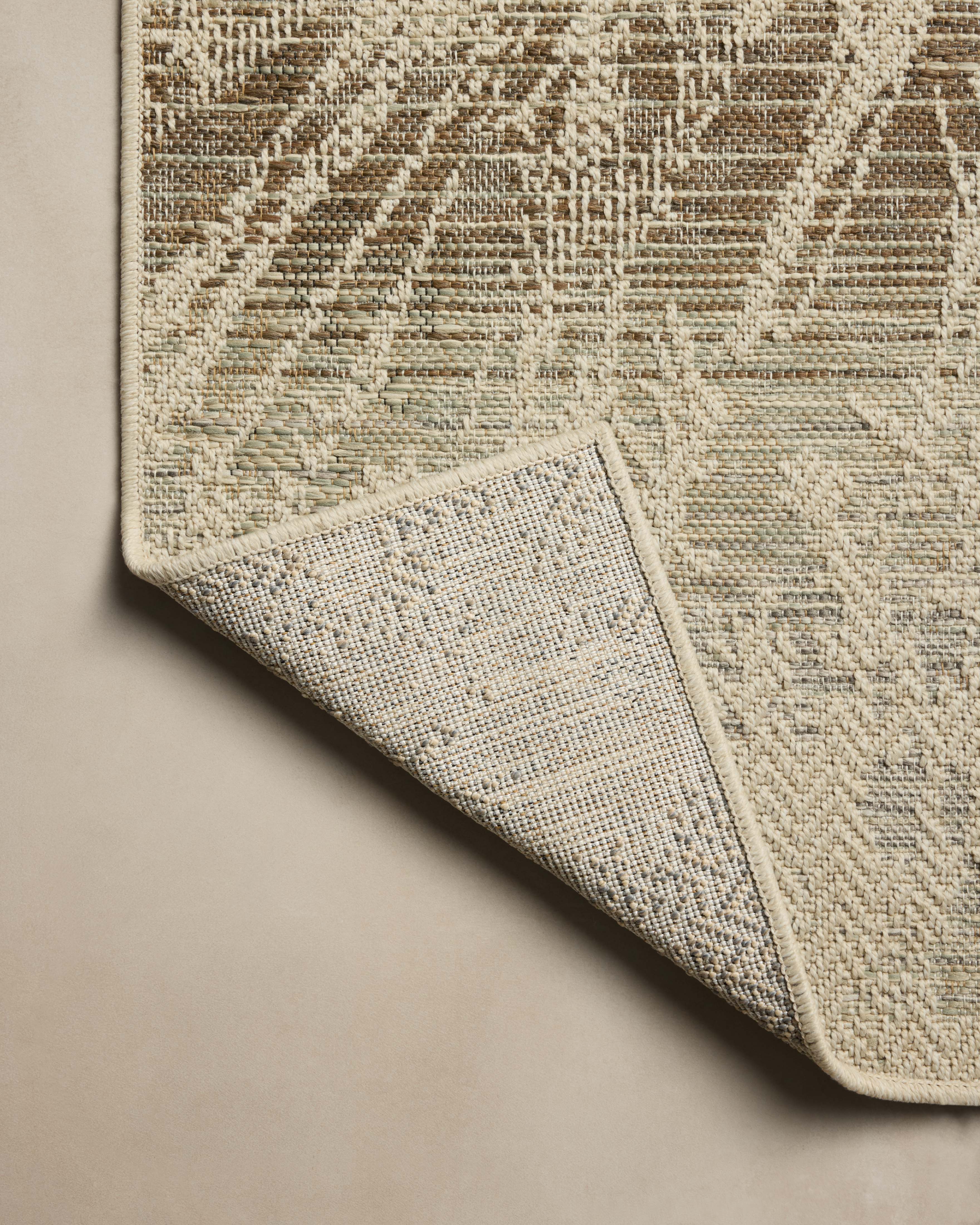 Finished in refined ivory and grounding stone tones, the Saylor SAY-10 Ivory / Stone Area Rug is a power-loomed polypropylene area rug for modern living