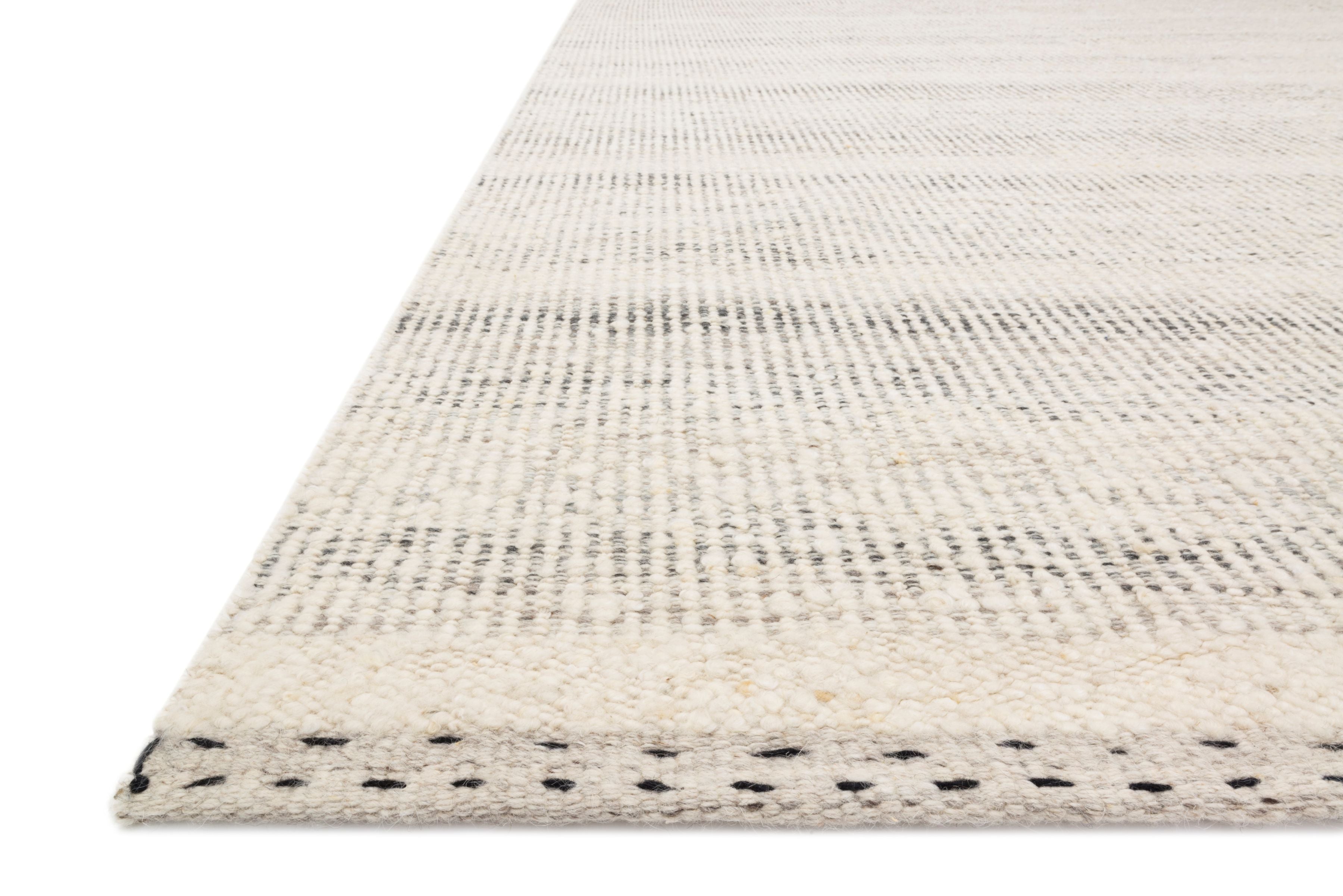 The Sloane SLN-01 Mist Area Rug showcases soft misty tones in a hand-woven wool, cotton, and polyester area rug with bohemian and contemporary style