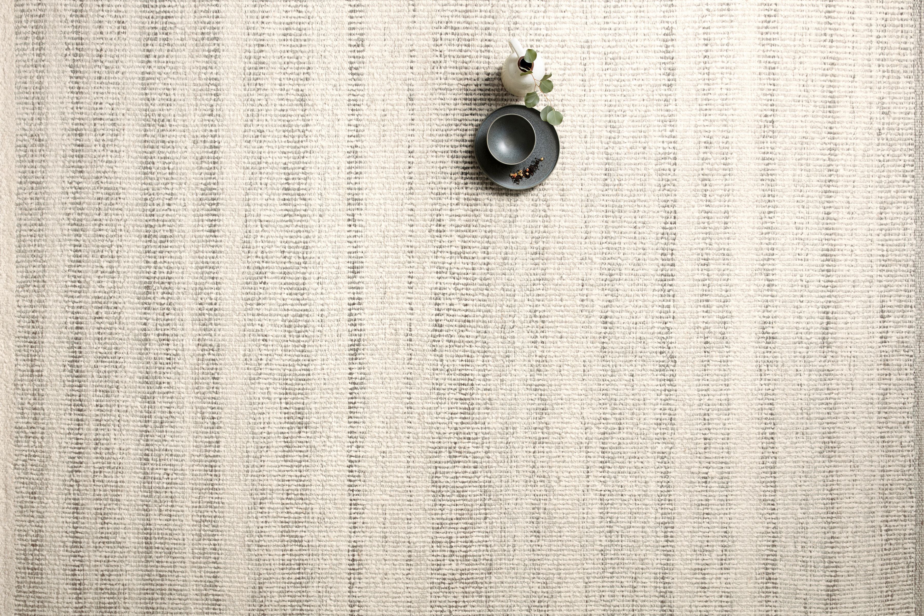The Sloane SLN-01 Mist Area Rug showcases soft misty tones in a hand-woven wool, cotton, and polyester area rug with bohemian and contemporary style