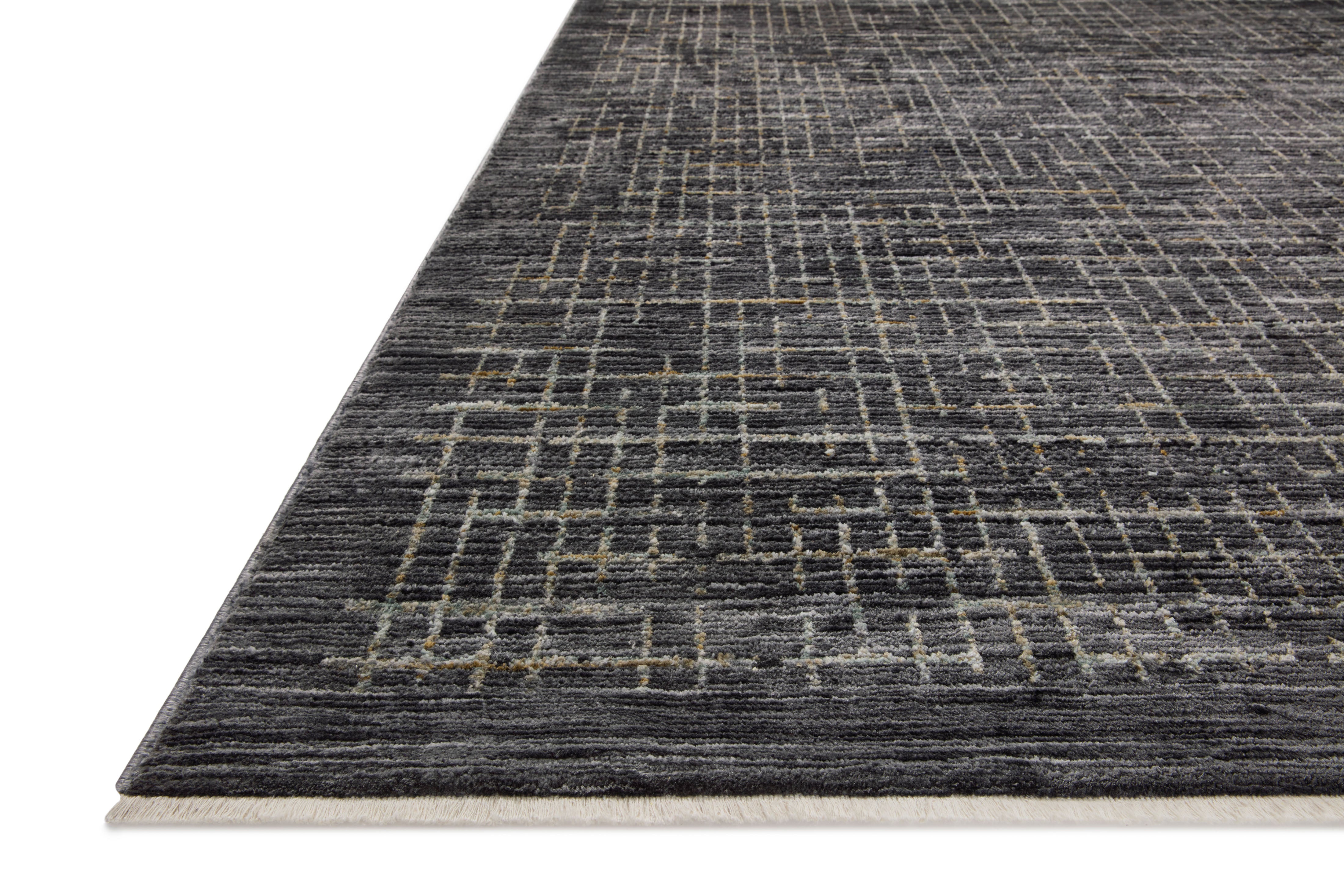 With bold onyx and shimmering silver hues and contemporary and abstract styling, the Soho SOH-01 Onyx / Silver Area Rug is a power-loomed 100% polyester area rug that elevates any room