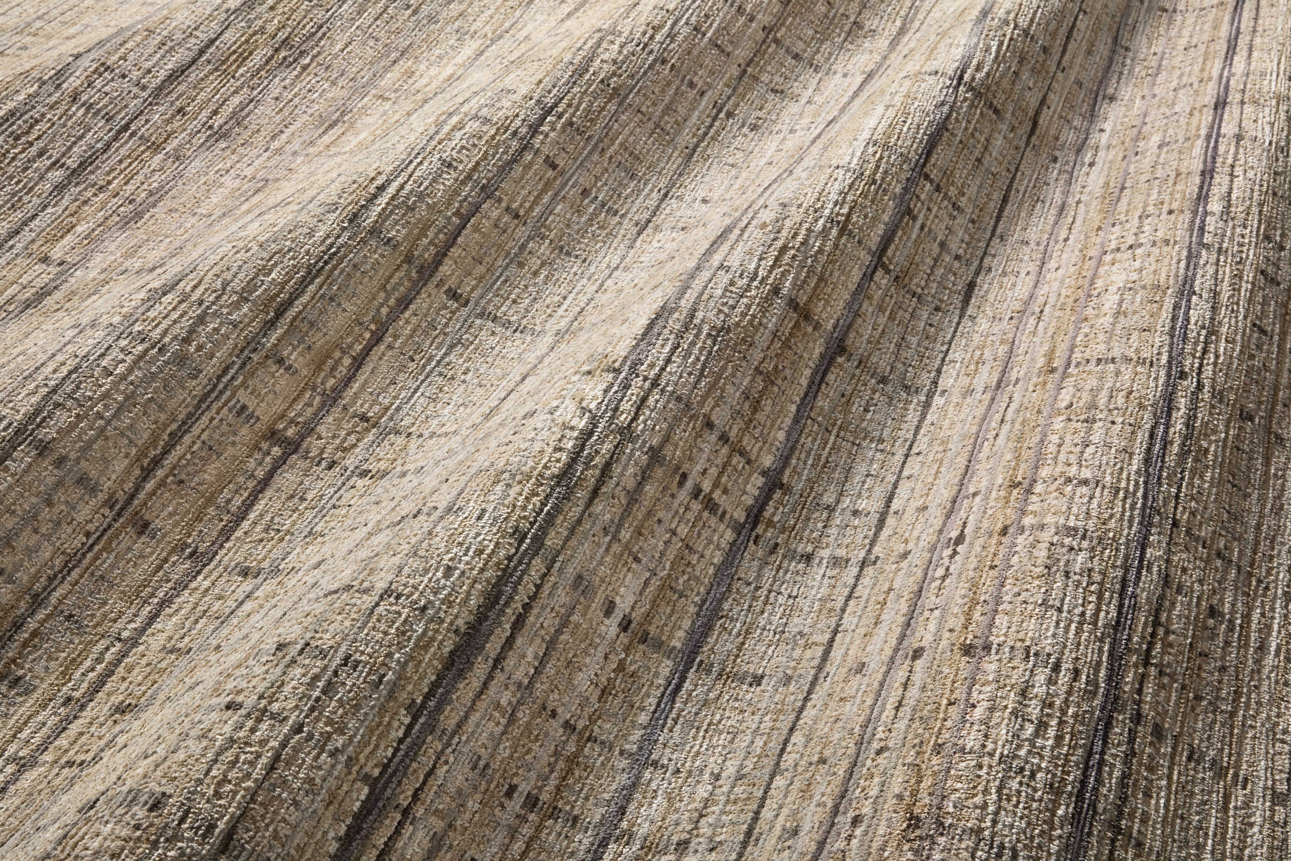 Designed with contemporary and abstract artistry in subtle pebble and deep charcoal hues, the Soho SOH-04 Pebble / Charcoal Area Rug is a power-loomed 100% polyester area rug that stands out