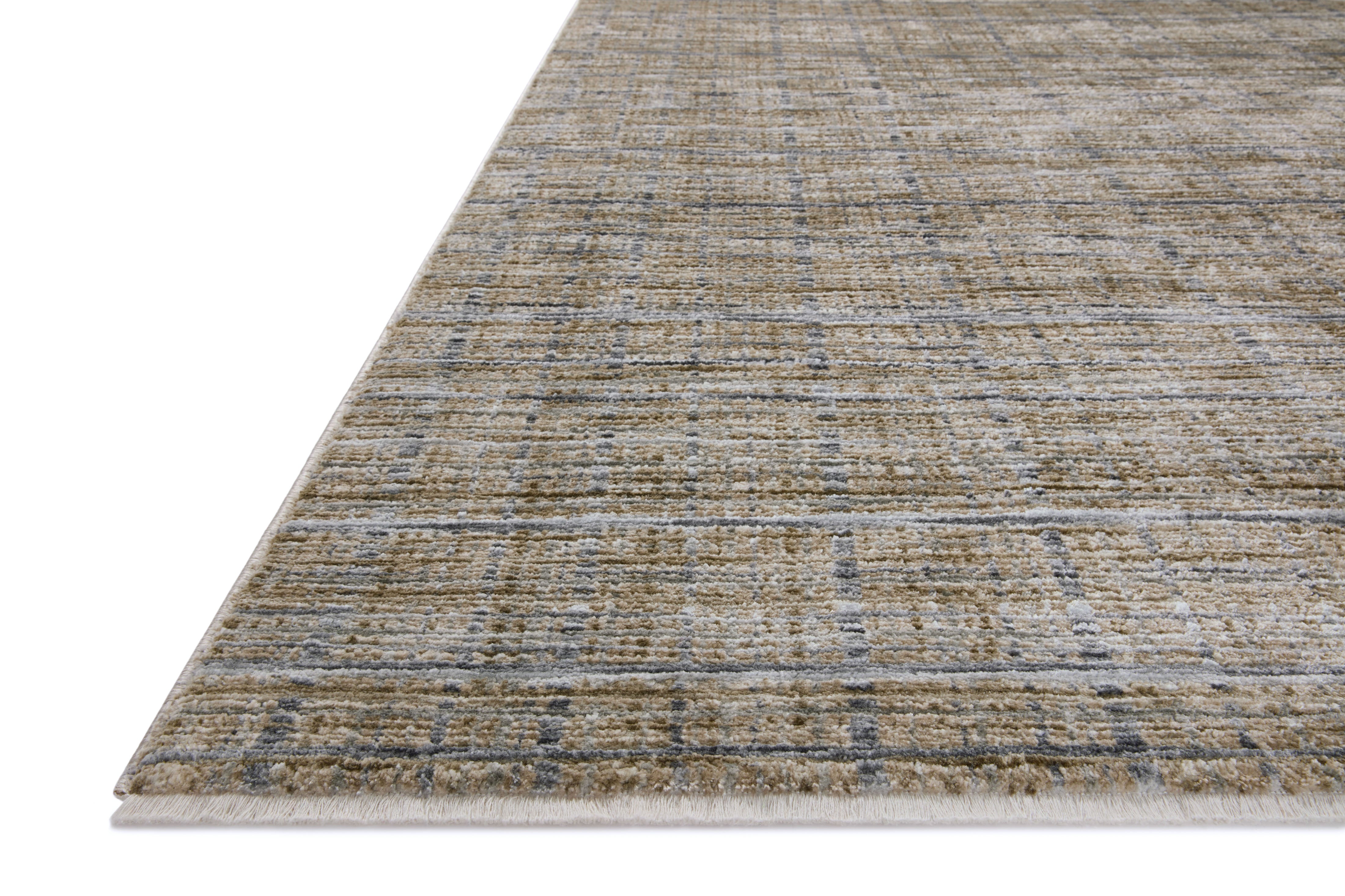 Designed with contemporary and abstract artistry in subtle pebble and deep charcoal hues, the Soho SOH-04 Pebble / Charcoal Area Rug is a power-loomed 100% polyester area rug that stands out
