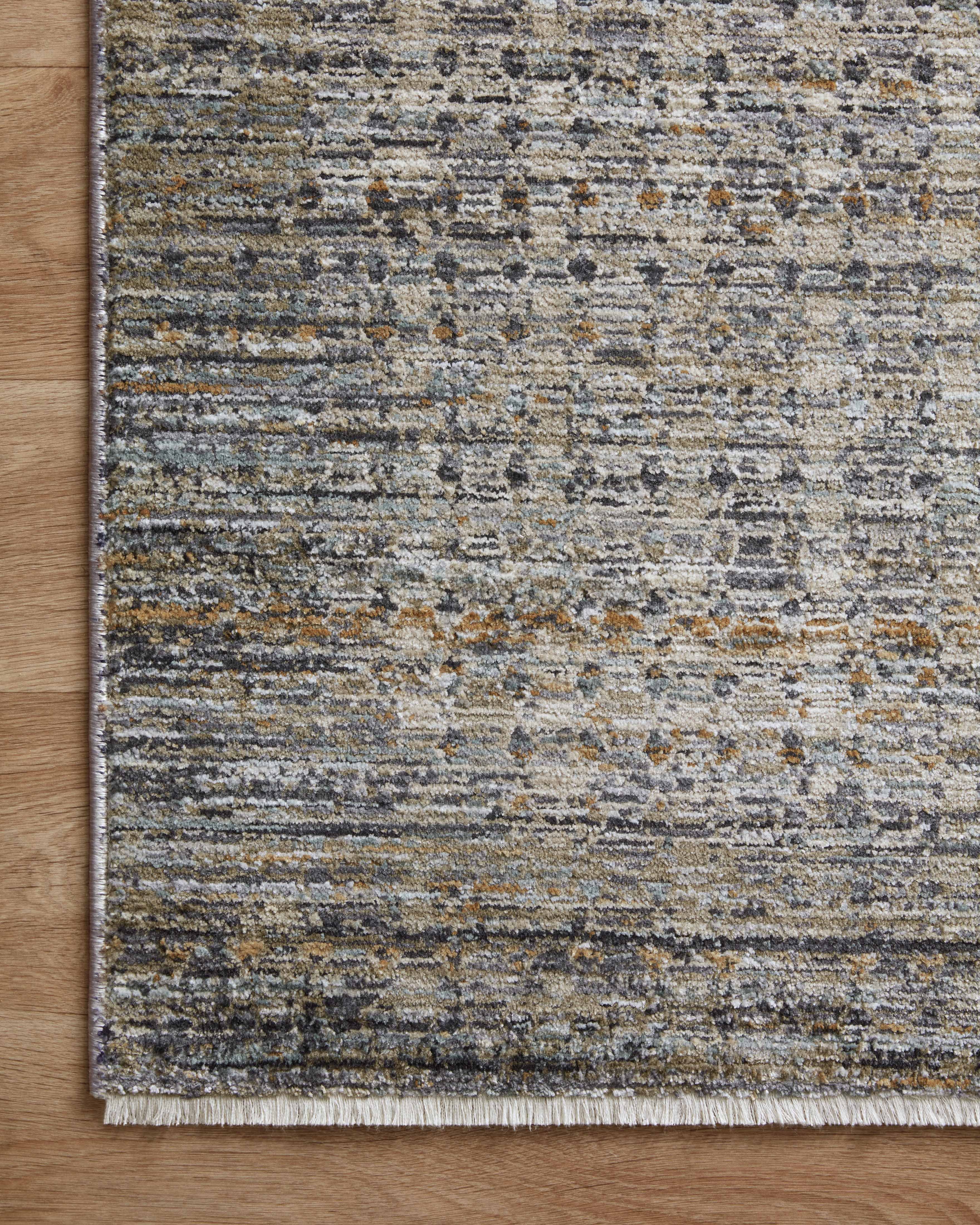 The Soho SOH-05 Charcoal / Multi Area Rug combines deep charcoal and vibrant multi-toned tones and contemporary and abstract patterns in a power-loomed 100% polyester area rug for effortless elegance