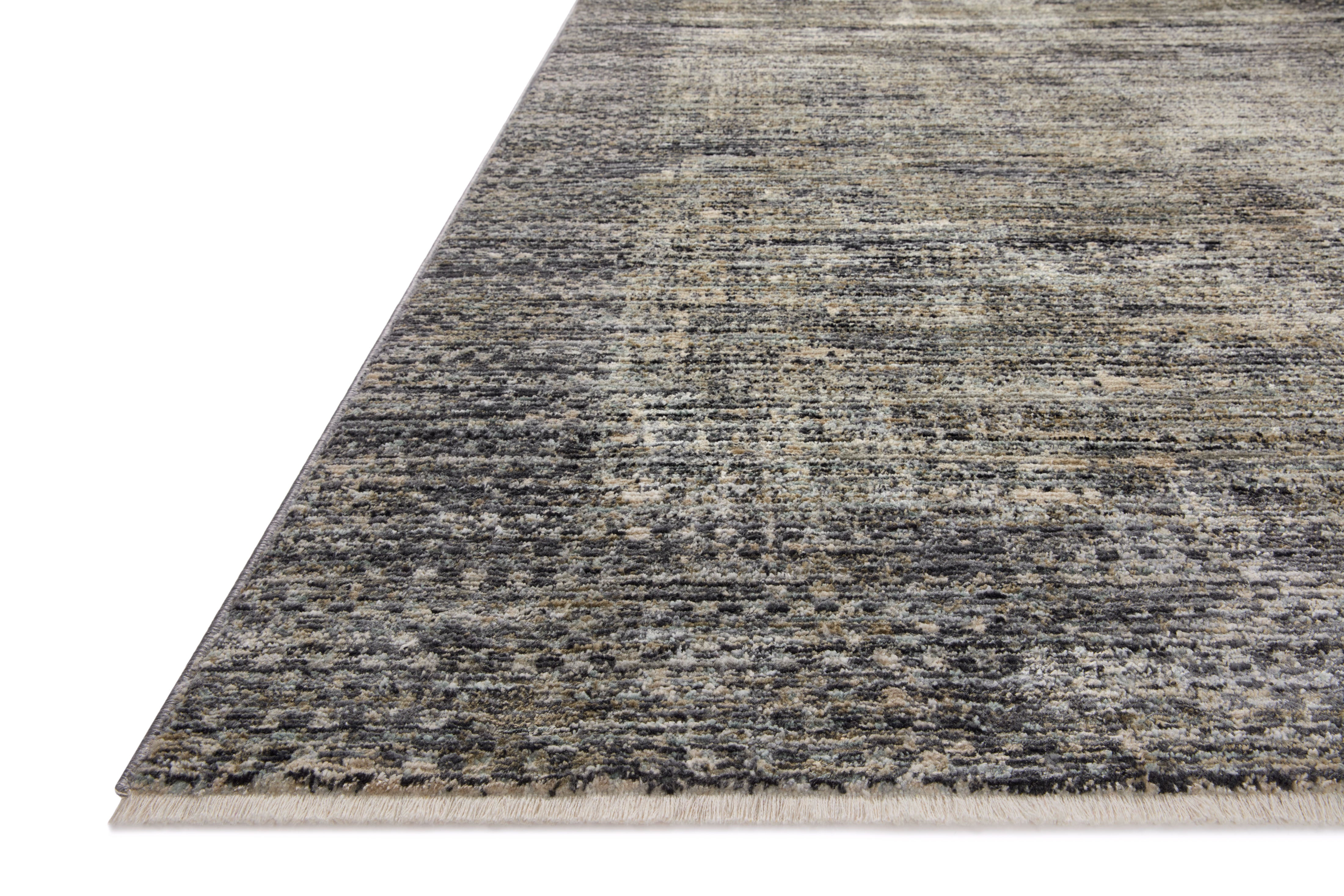 A power-loomed 100% polyester area rug featuring contemporary and abstract design and vibrant multi-toned and cool slate tones, the Soho SOH-06 Multi / Slate Area Rug adds character to any room