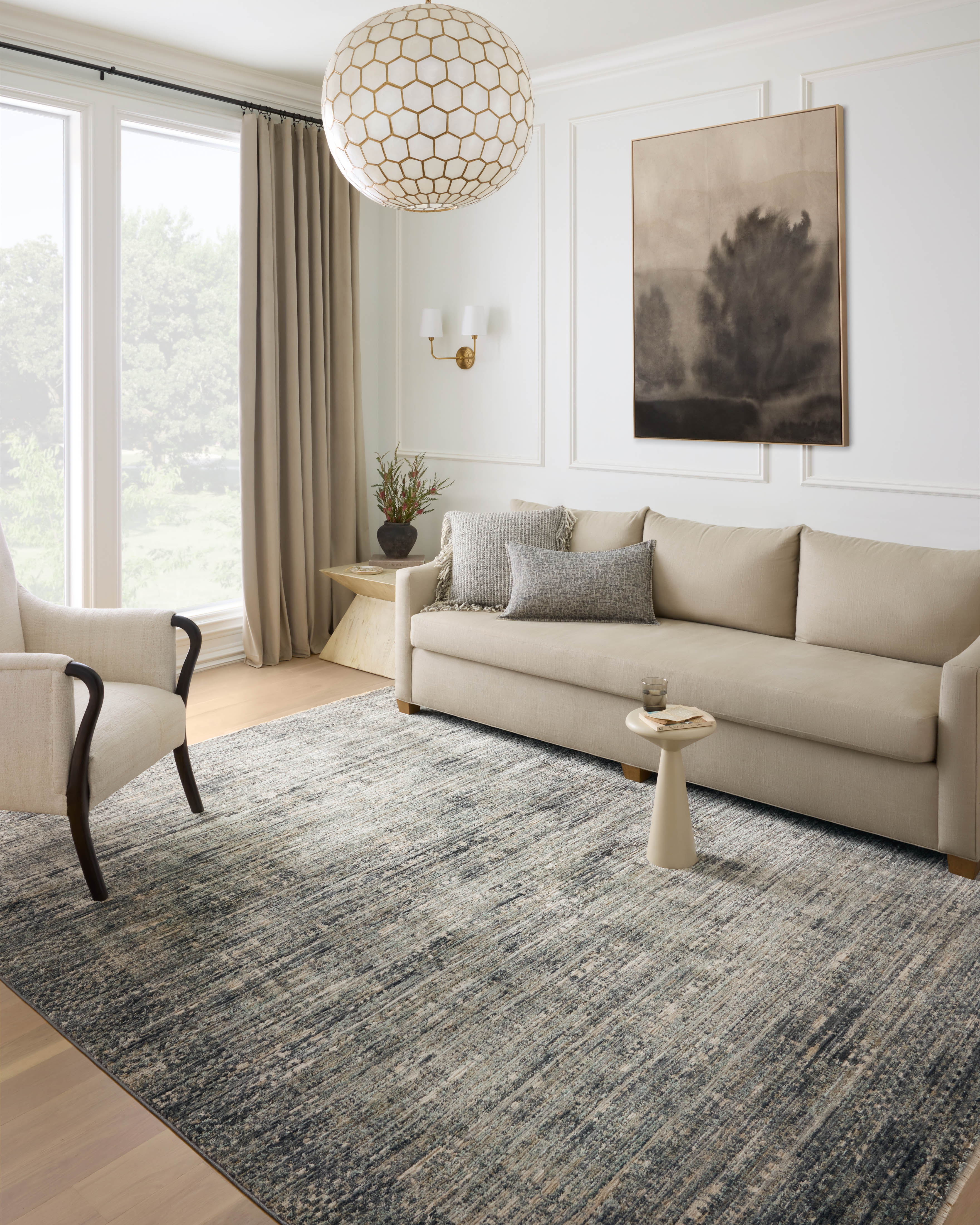 A power-loomed 100% polyester area rug featuring contemporary and abstract design and vibrant multi-toned and cool slate tones, the Soho SOH-06 Multi / Slate Area Rug adds character to any room