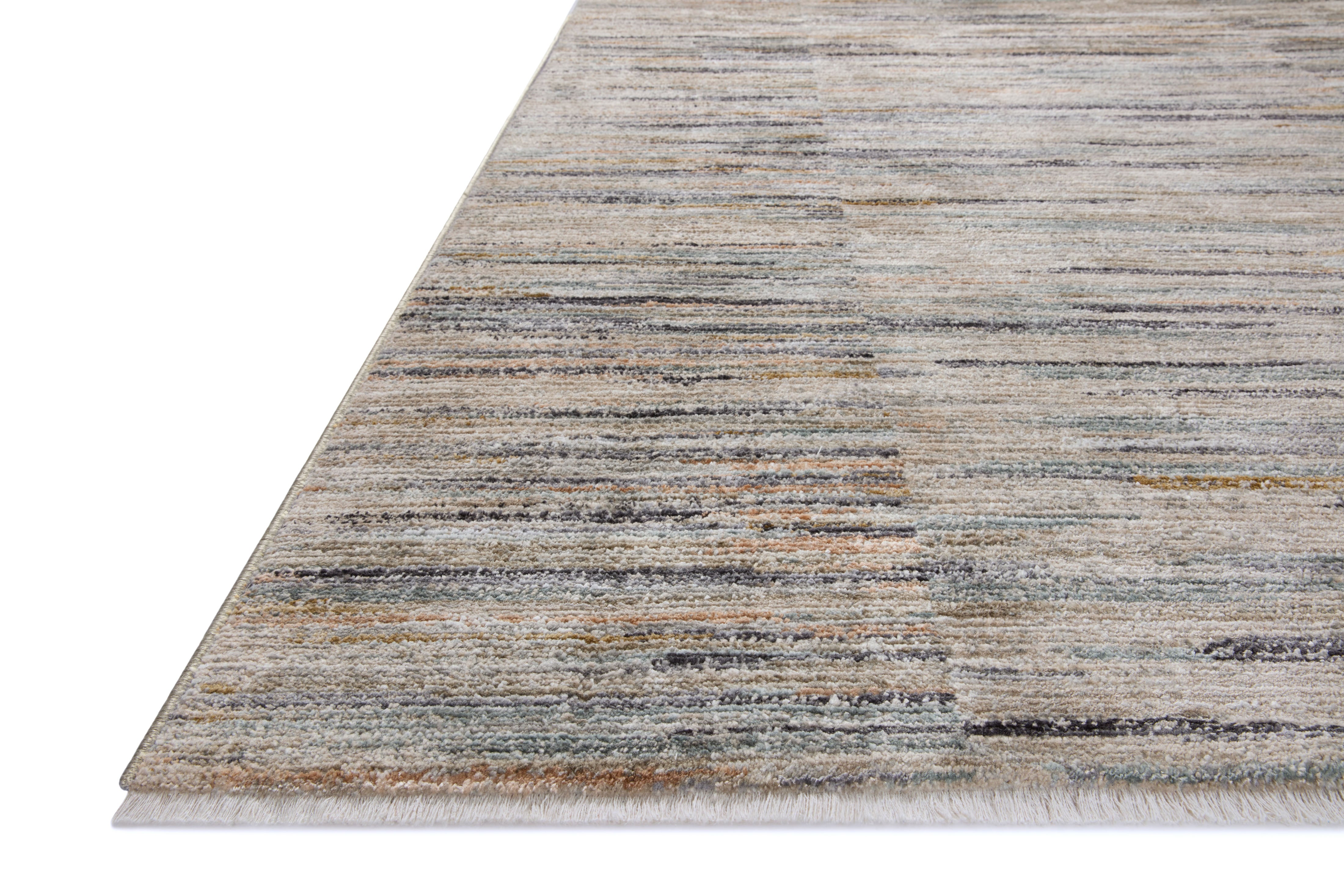 Rich in vibrant multi-toned and gentle dove hues with contemporary and abstract detail, the Soho SOH-07 Multi / Dove Area Rug is a power-loomed 100% polyester area rug built for style and comfort