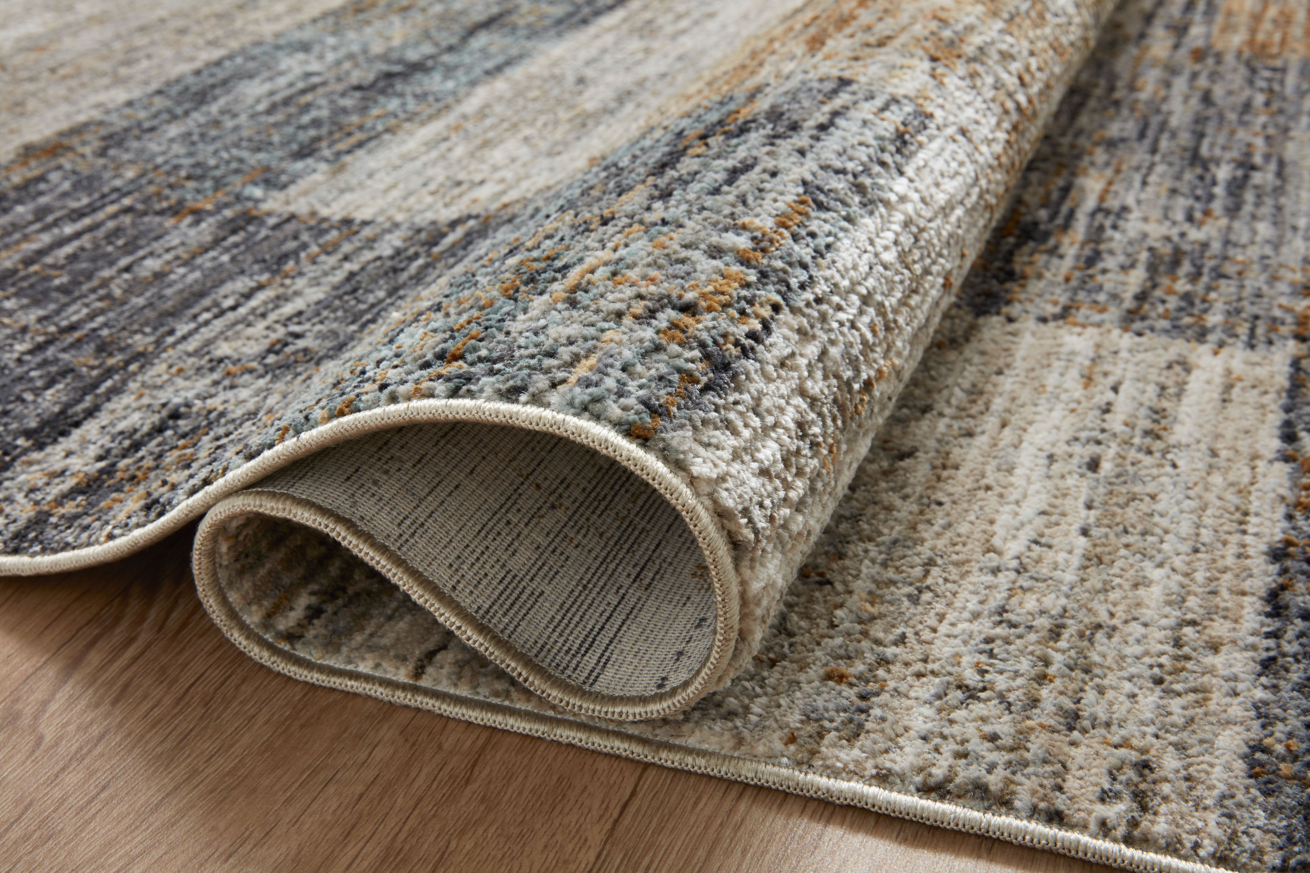The Soho SOH-08 Grey / Gold Area Rug offers elegant grey and radiant gold sophistication and contemporary and abstract charm in a power-loomed 100% polyester area rug
