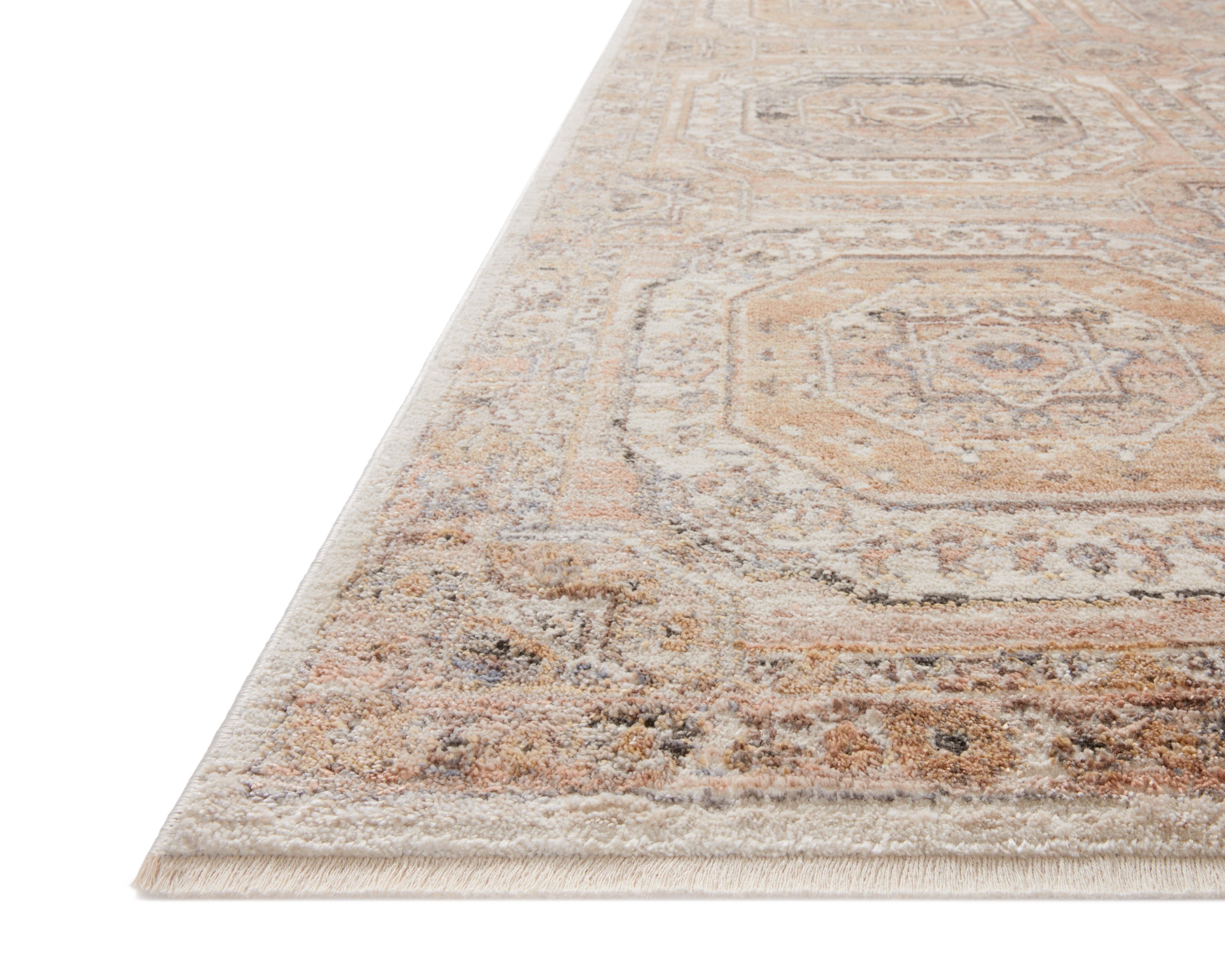 A power-loomed polypropylene and polyester area rug in warm apricot and vibrant multi-toned tones with traditional motifs, the Sonnet SNN-06 Apricot / Multi Area Rug grounds your room beautifully
