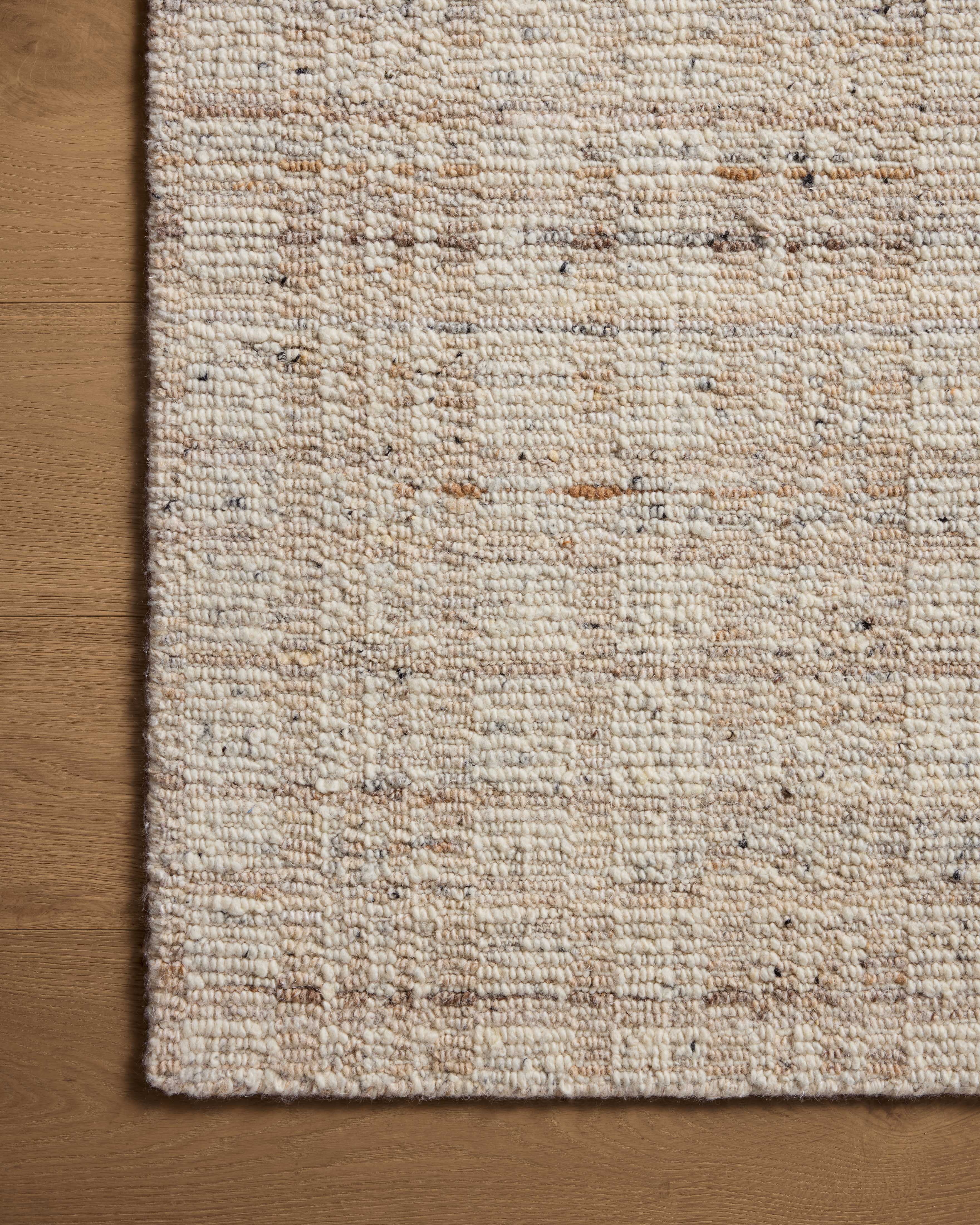 Expertly crafted as a hand-loomed wool area rug with graphic artistry, the Sonya SOY-01 Ivory / Natural Area Rug captures refined ivory and warm natural tones beautifully