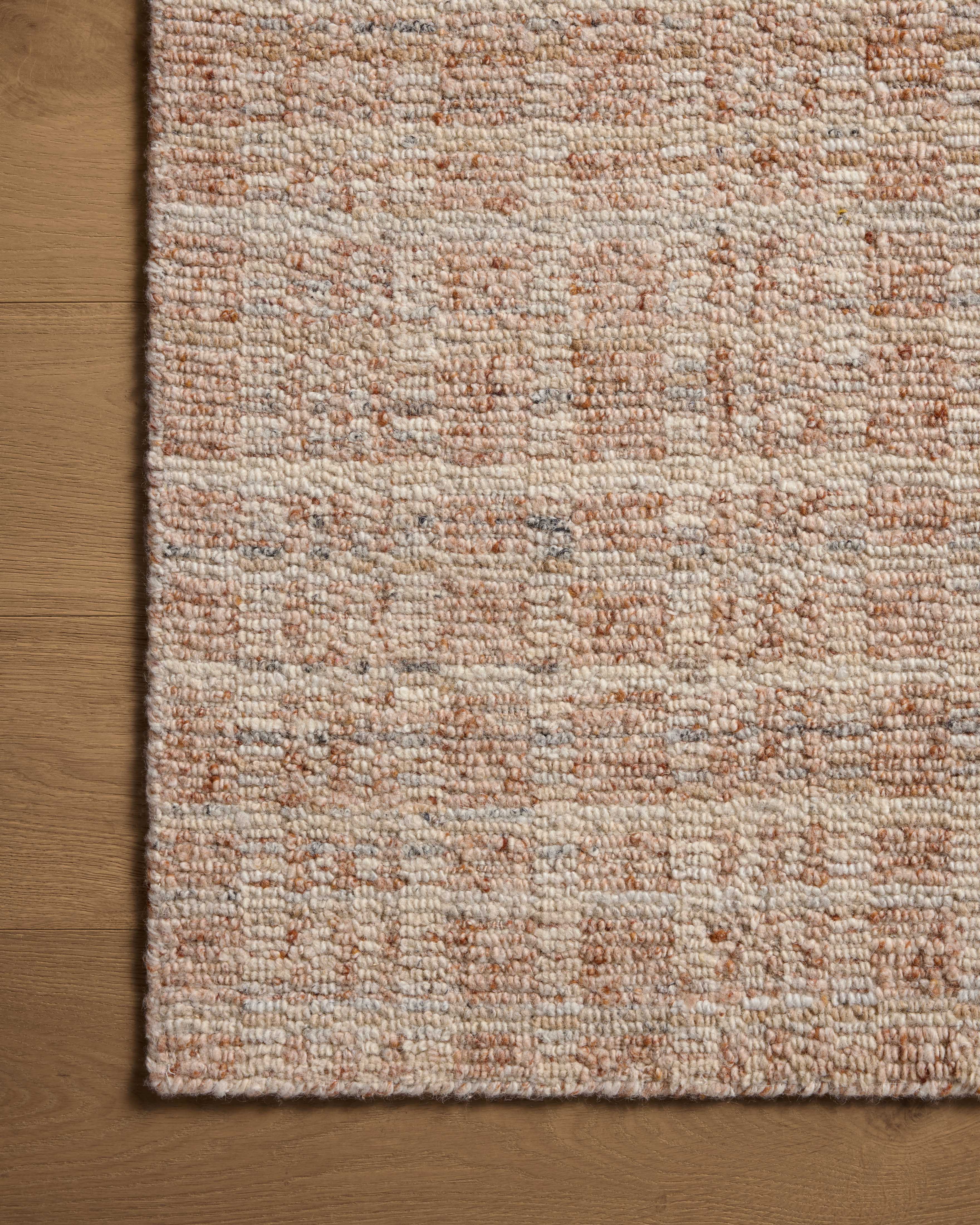 The Sonya SOY-01 Terracotta / Natural Area Rug brings rich terracotta and warm natural character and graphic flair to your home in a hand-loomed wool area rug