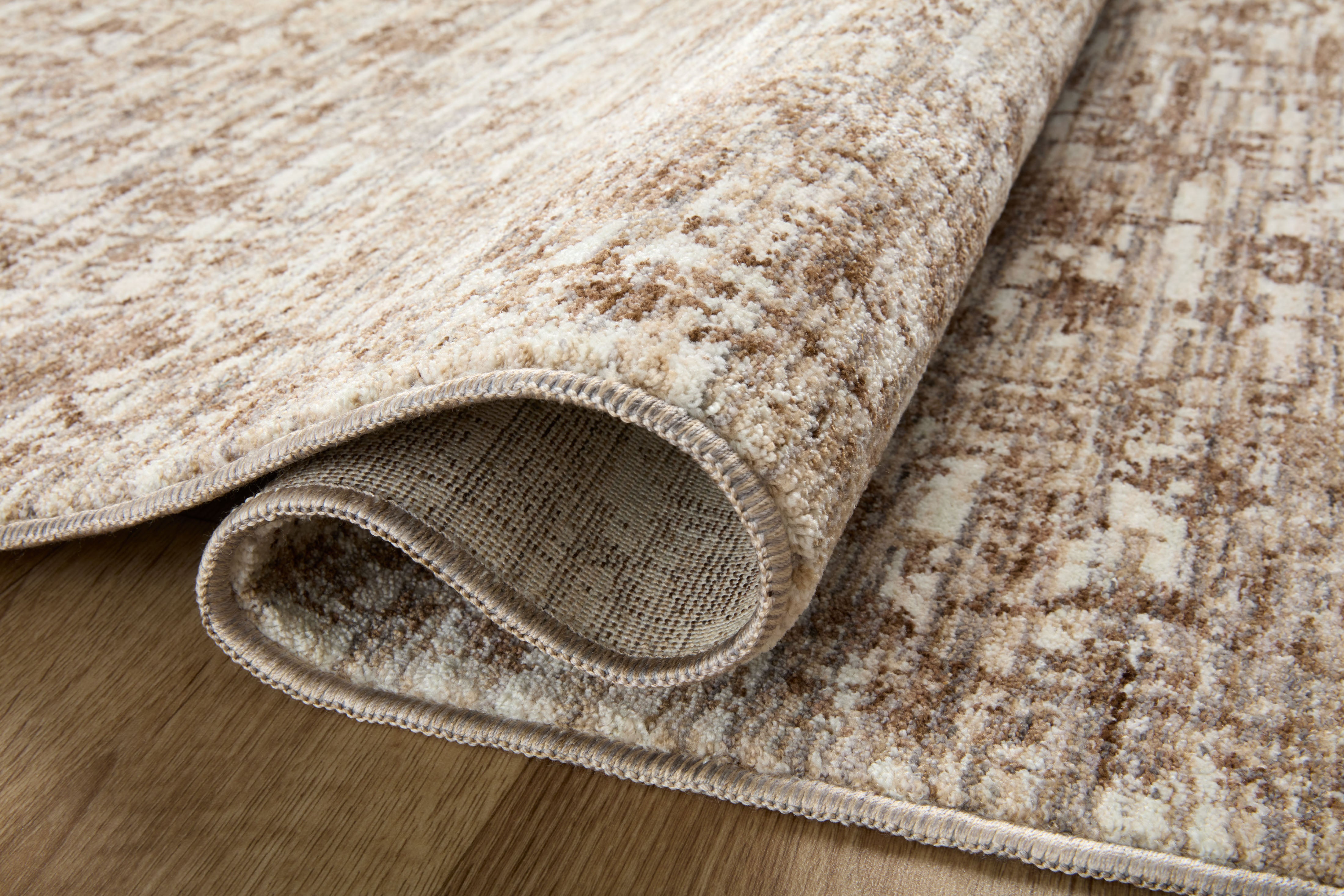 A power-loomed 100% polyester area rug with vintage flair in grounded bark and warm natural tones, the Sorrento SOR-01 Bark / Natural Area Rug anchors any room