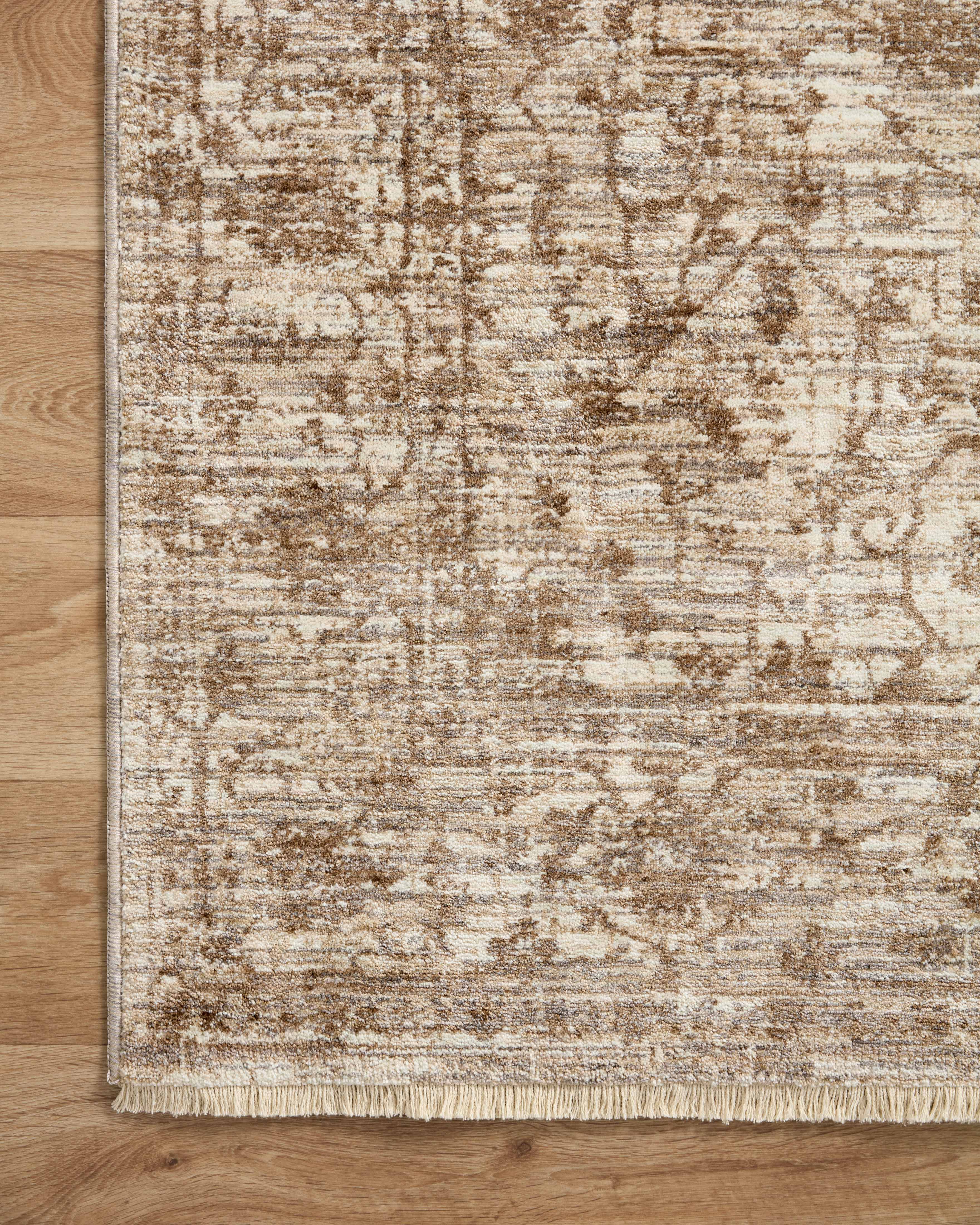 A power-loomed 100% polyester area rug with vintage flair in grounded bark and warm natural tones, the Sorrento SOR-01 Bark / Natural Area Rug anchors any room