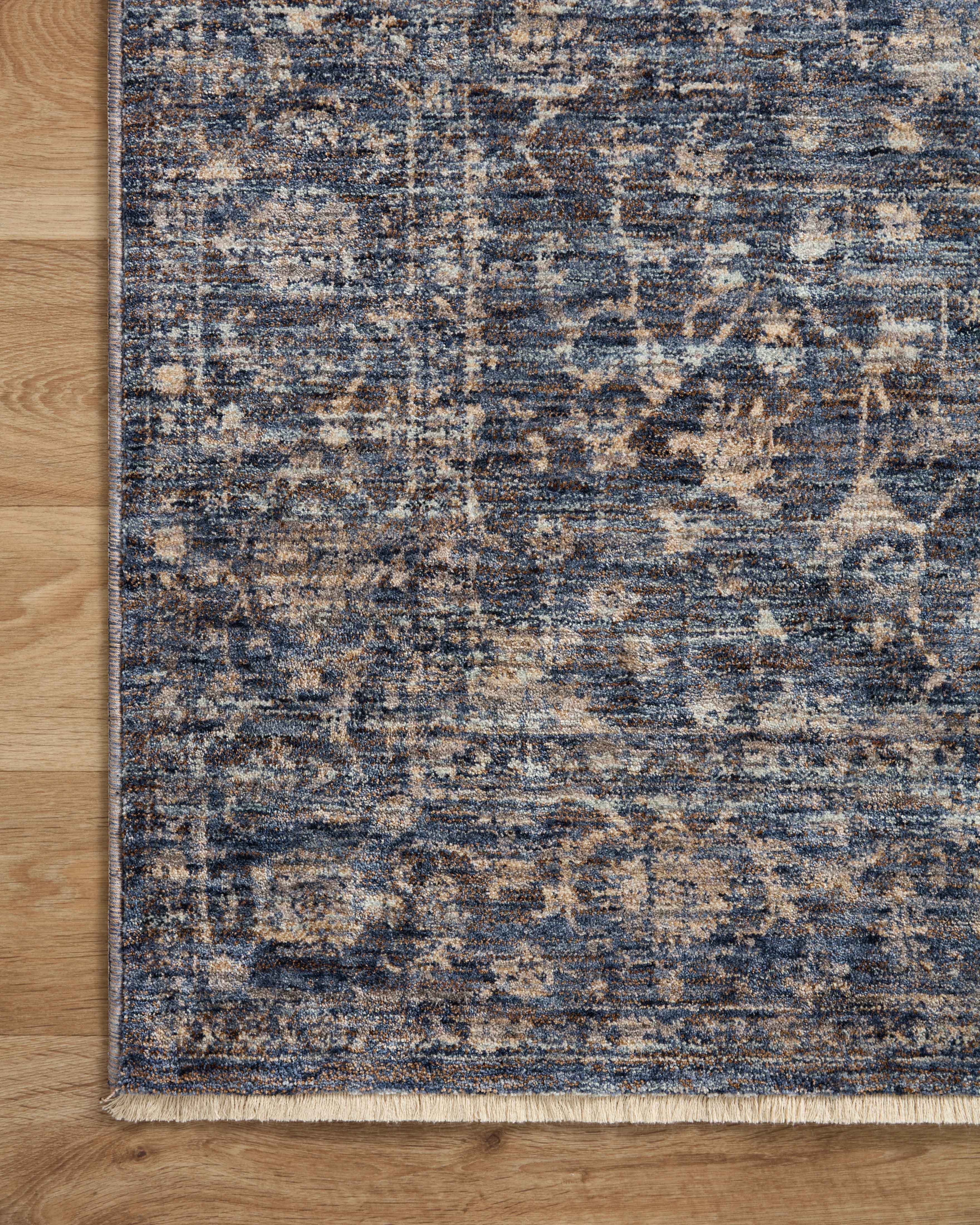 The Sorrento SOR-01 Midnight / Natural Area Rug pairs dramatic midnight and warm natural tones and vintage patterns in a power-loomed 100% polyester area rug