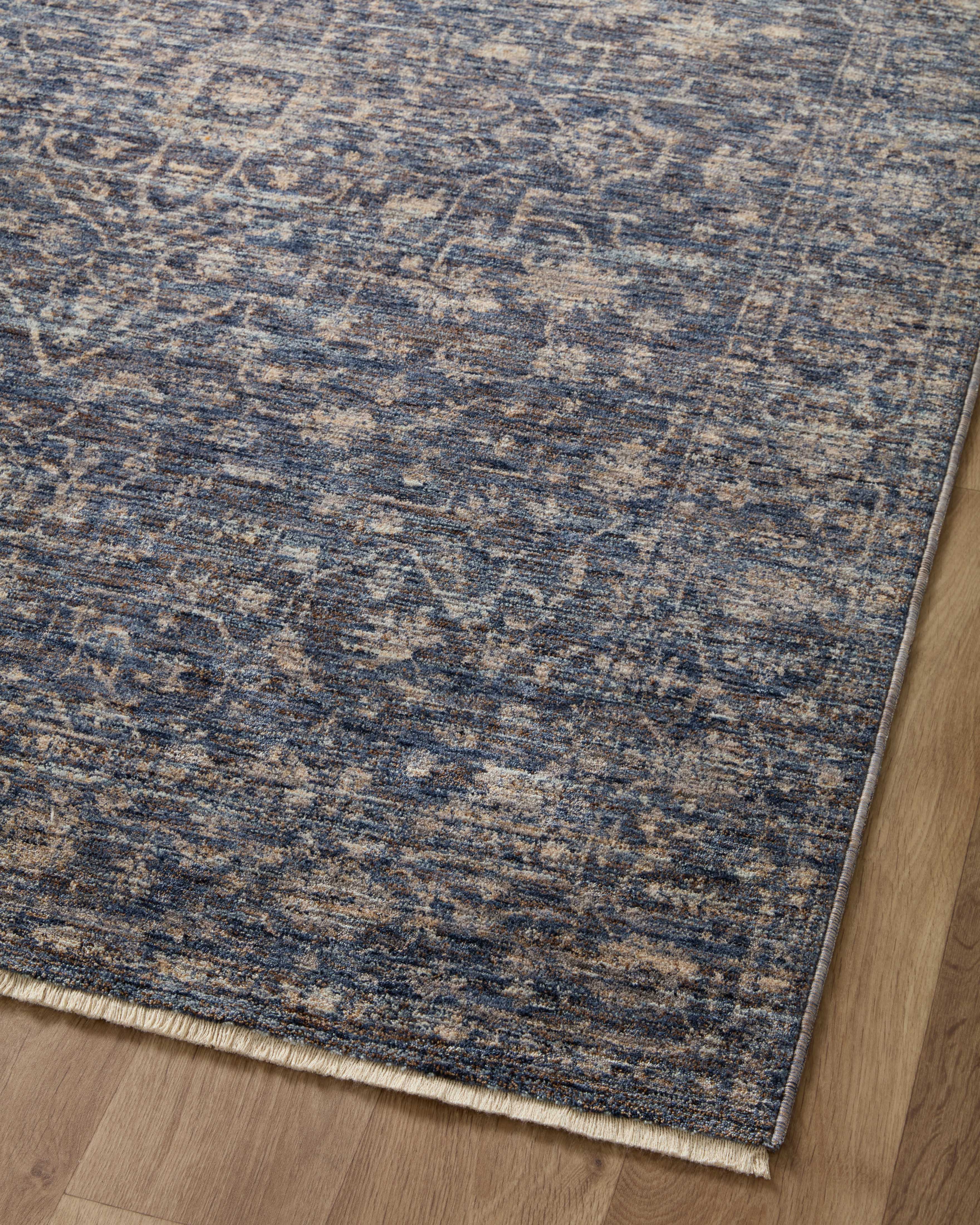 The Sorrento SOR-01 Midnight / Natural Area Rug pairs dramatic midnight and warm natural tones and vintage patterns in a power-loomed 100% polyester area rug