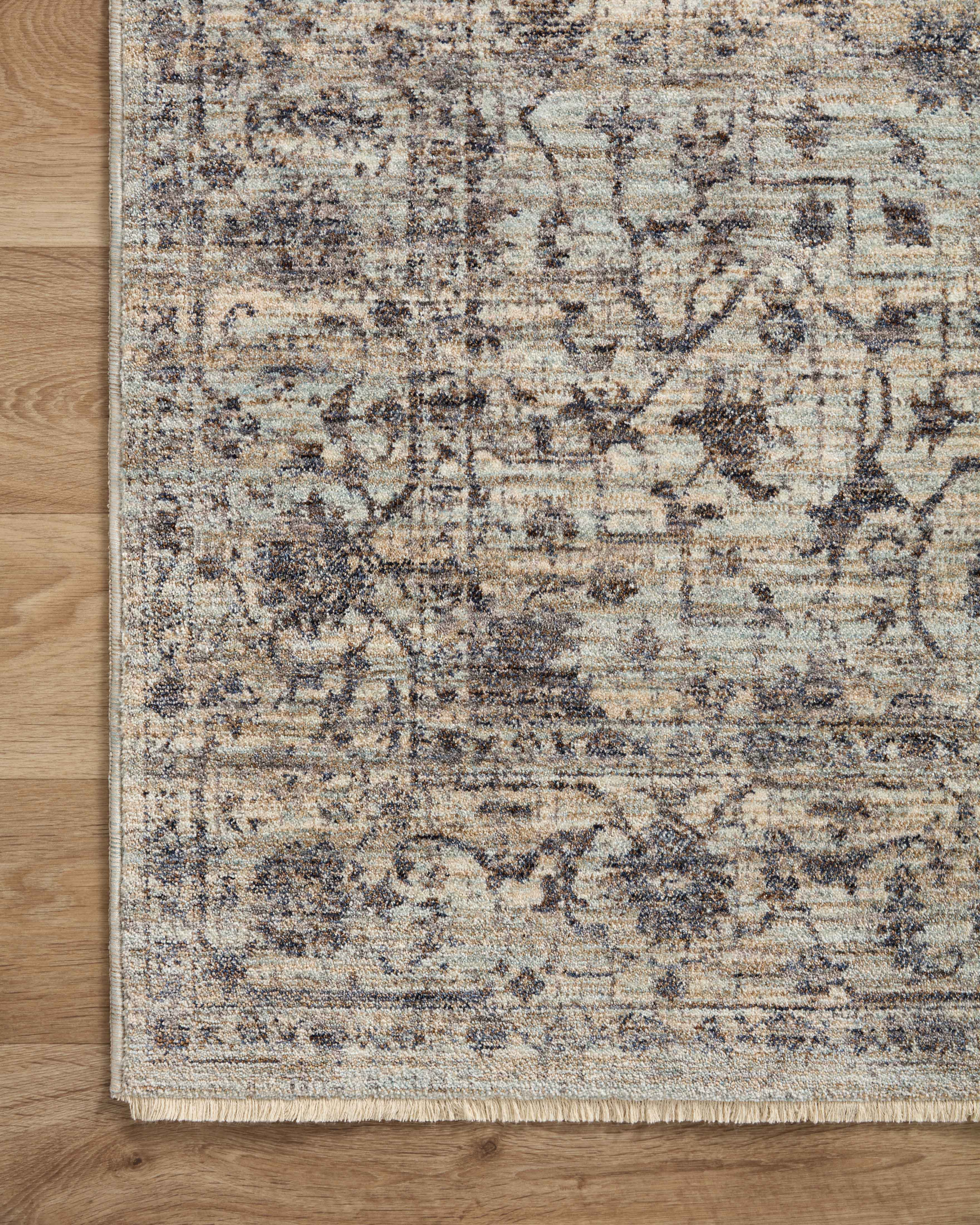 Crafted as a power-loomed 100% polyester area rug, the Sorrento SOR-01 Mist / Charcoal Area Rug brings soft misty and deep charcoal warmth and vintage character to your space