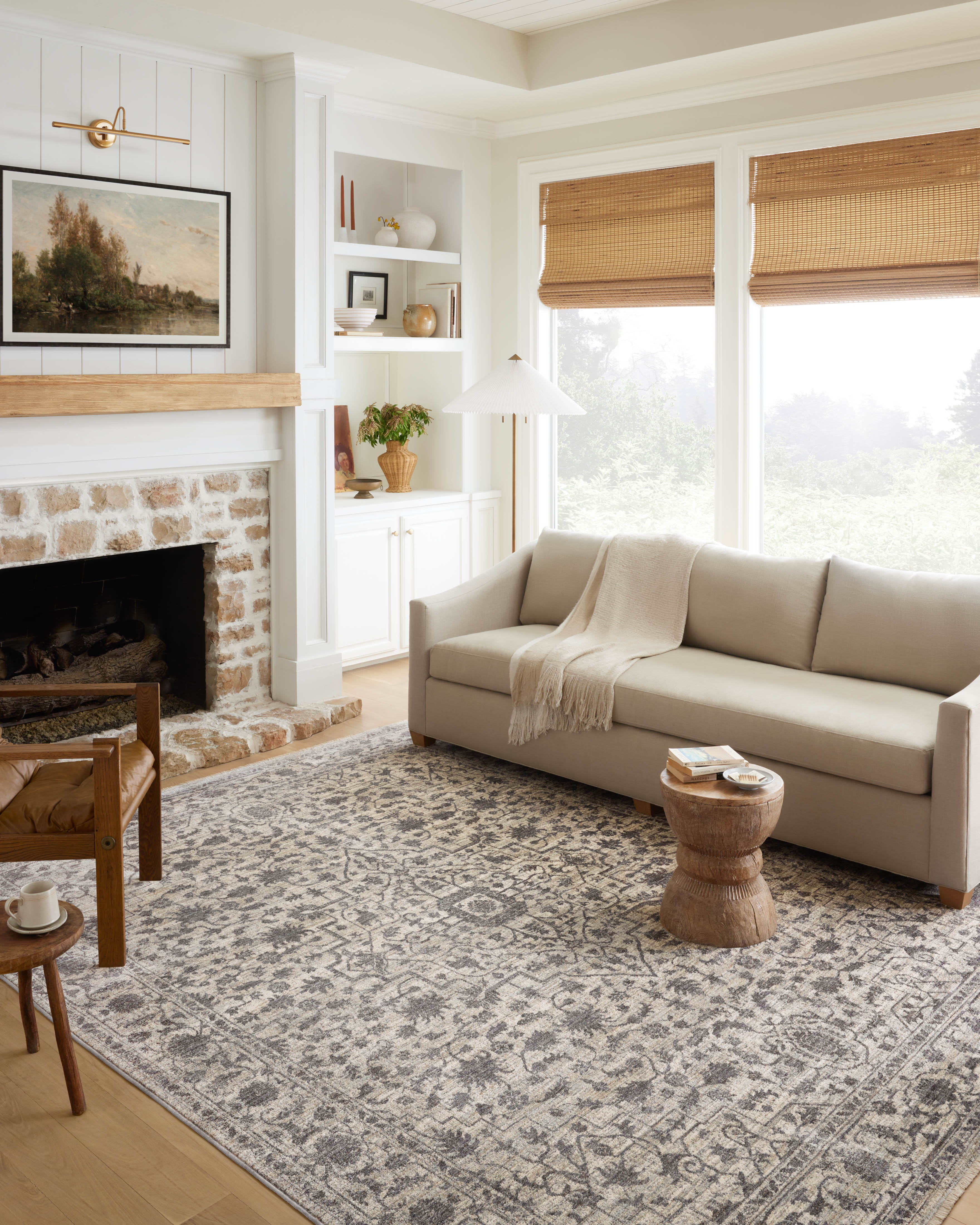 Crafted as a power-loomed 100% polyester area rug, the Sorrento SOR-01 Mist / Charcoal Area Rug brings soft misty and deep charcoal warmth and vintage character to your space
