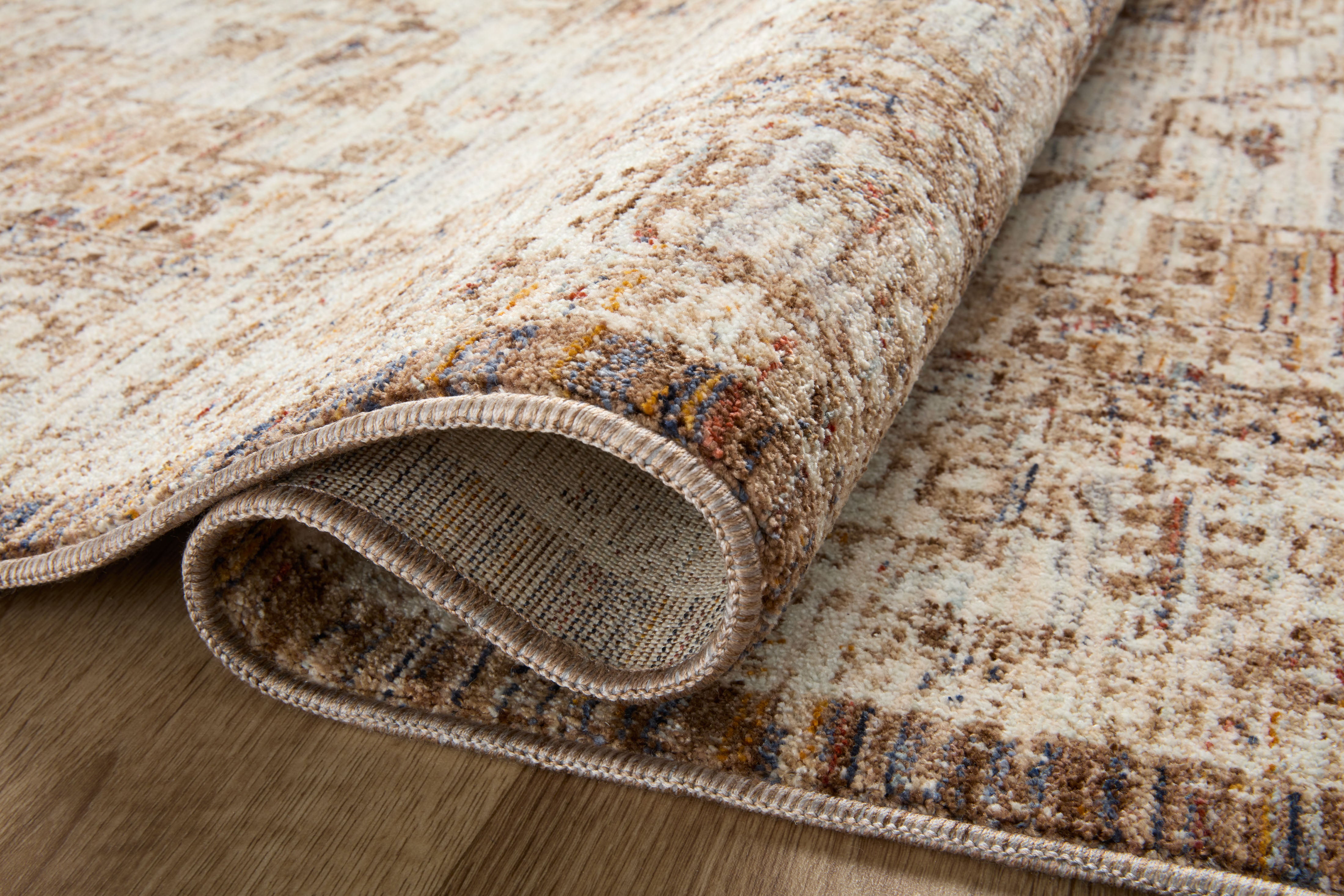 The Sorrento SOR-03 Mocha / Multi Area Rug blends luxurious mocha and vibrant multi-toned tones and vintage motifs into a power-loomed 100% polyester area rug with timeless appeal