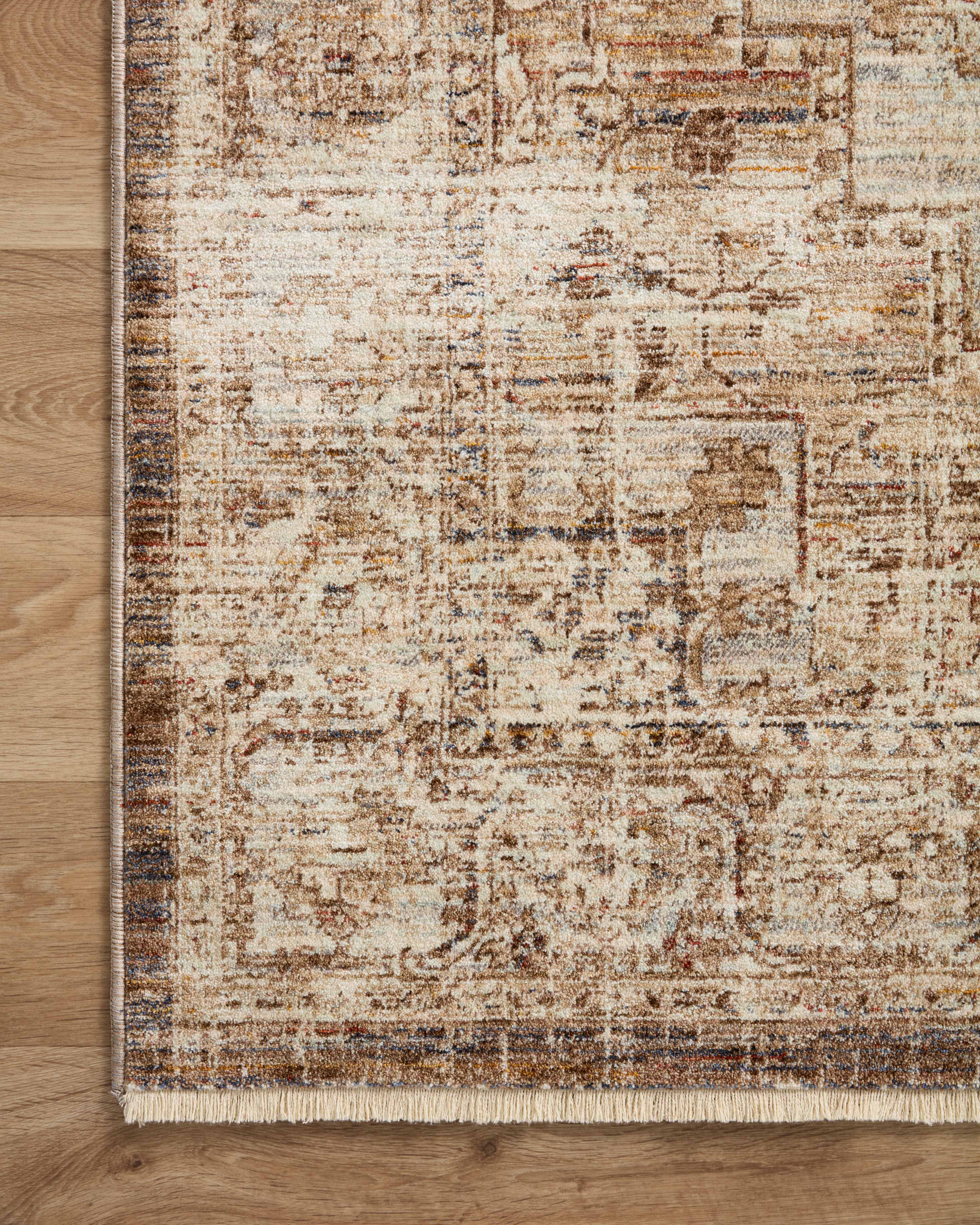 The Sorrento SOR-03 Mocha / Multi Area Rug blends luxurious mocha and vibrant multi-toned tones and vintage motifs into a power-loomed 100% polyester area rug with timeless appeal