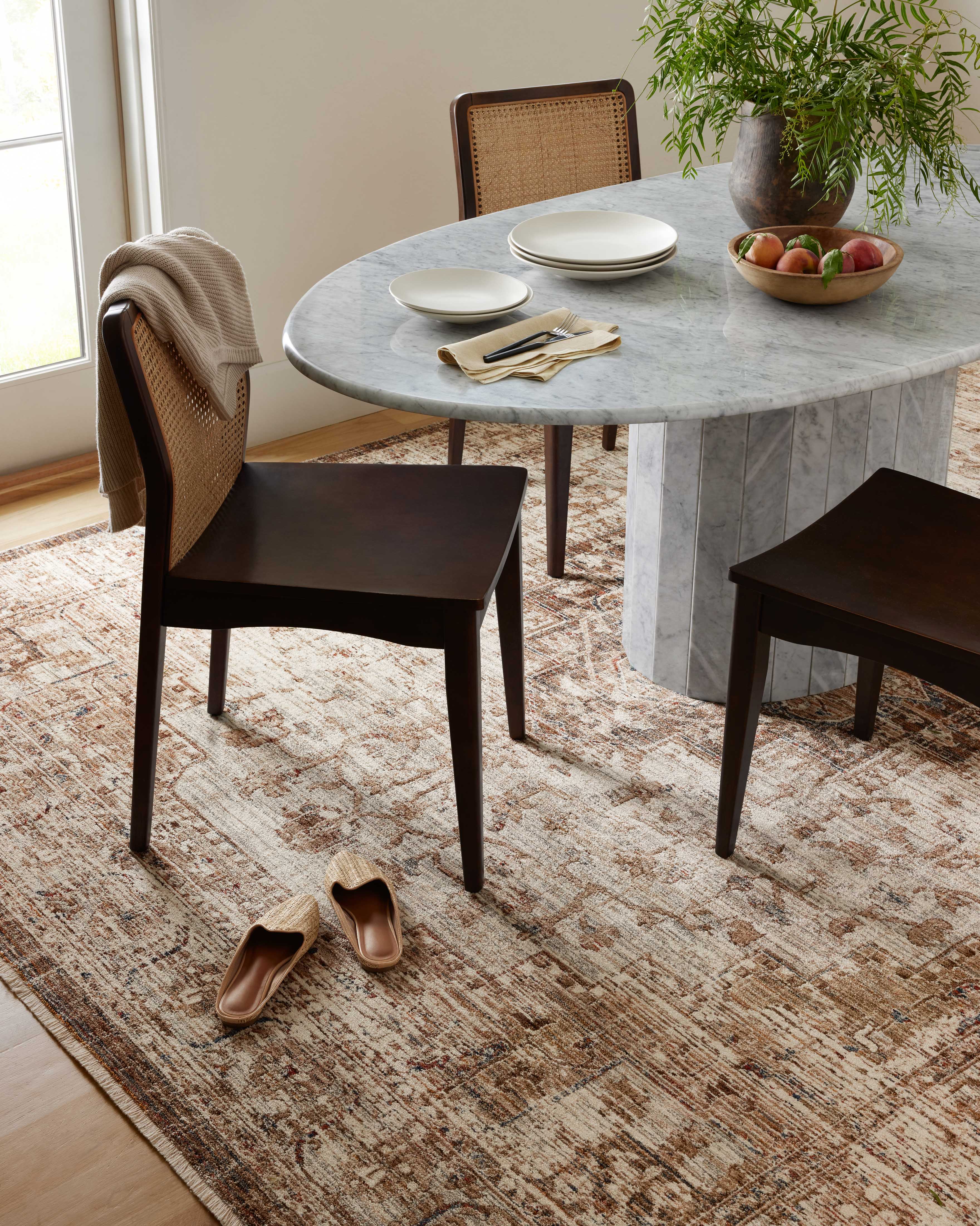 The Sorrento SOR-03 Mocha / Multi Area Rug blends luxurious mocha and vibrant multi-toned tones and vintage motifs into a power-loomed 100% polyester area rug with timeless appeal