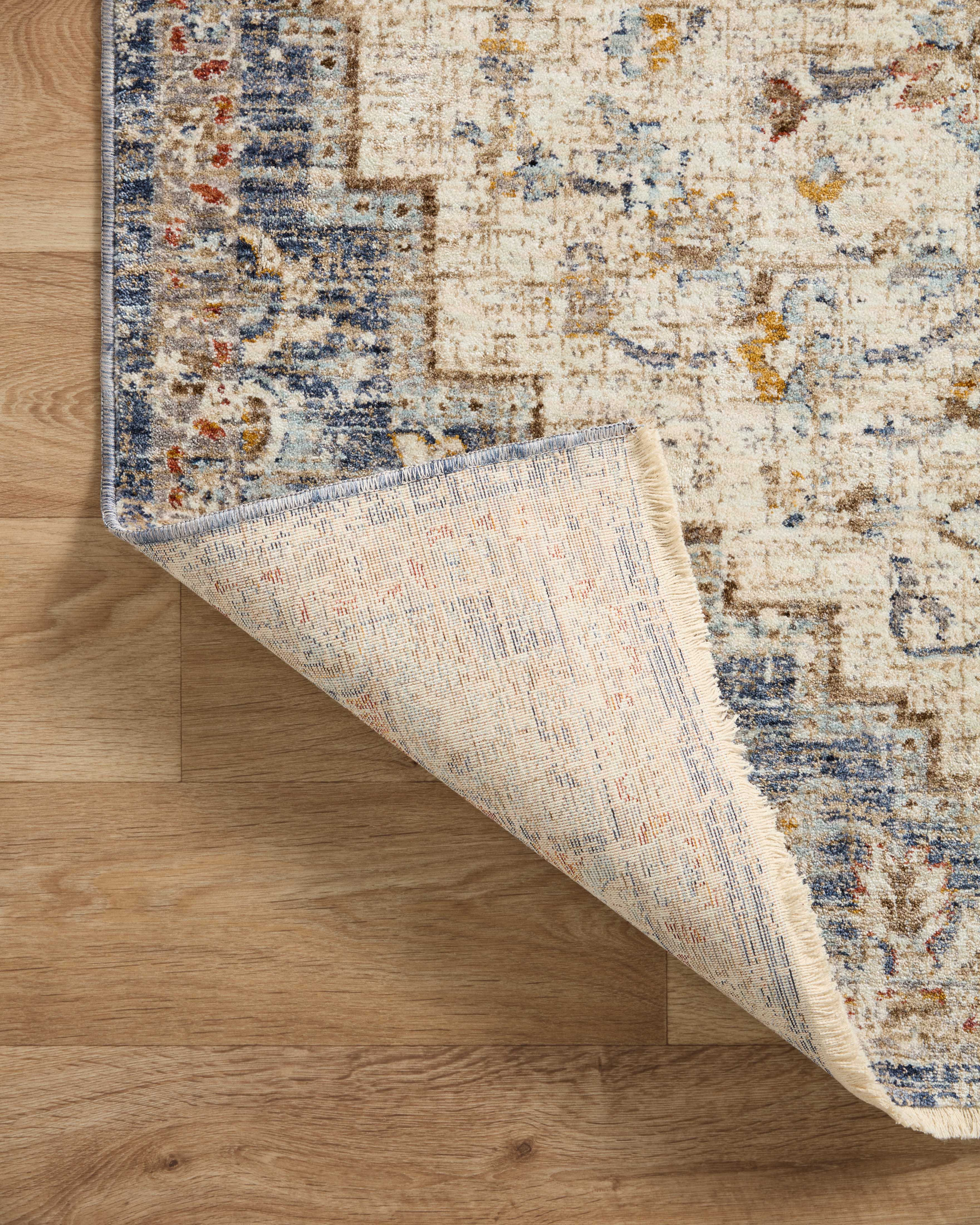 The Sorrento SOR-05 Ivory / Fiesta Area Rug delivers refined ivory and lively fiesta beauty and vintage elegance in a power-loomed 100% polyester area rug