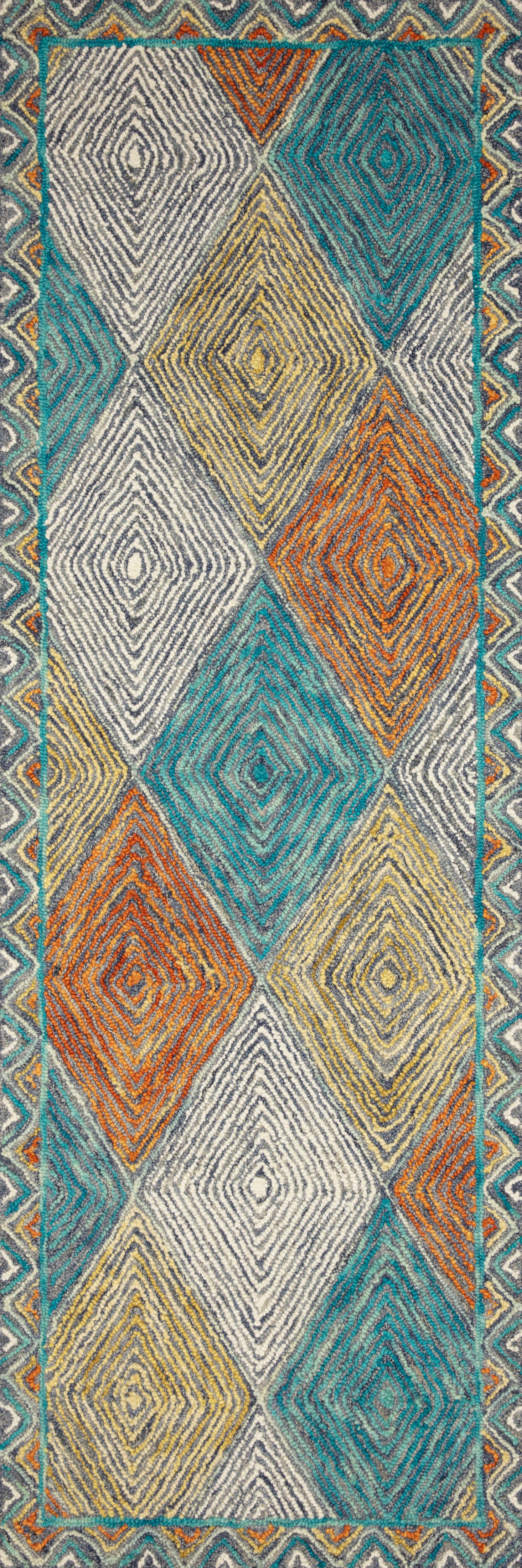 The Spectrum SPE-02 Sunset / Ocean Area Rug offers glowing sunset and serene ocean sophistication and geometric and eclectic charm in a hooked wool area rug