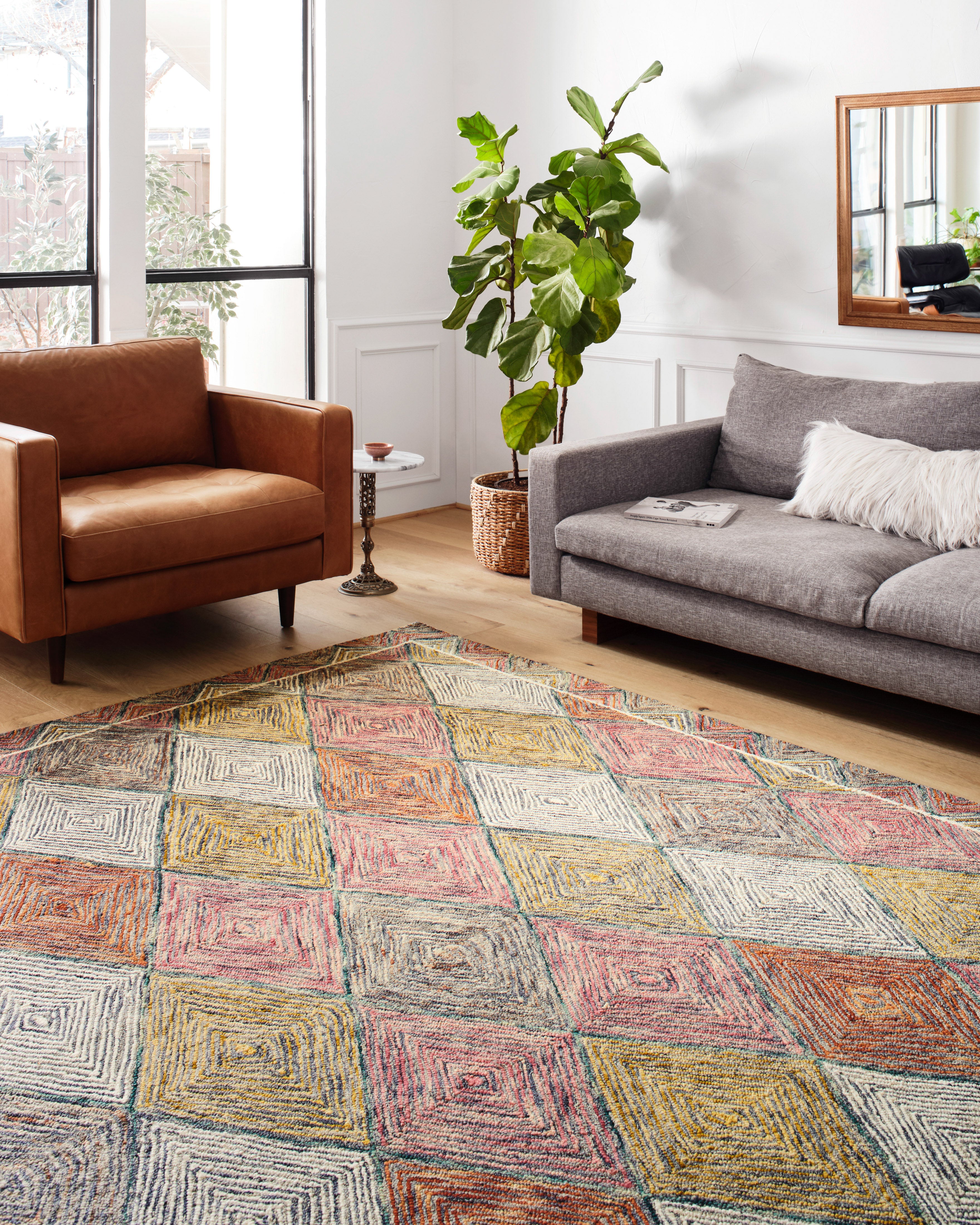 Expertly crafted as a hooked wool area rug with geometric and eclectic artistry, the Spectrum SPE-02 Turquoise / Fiesta Area Rug captures vivid turquoise and lively fiesta tones beautifully