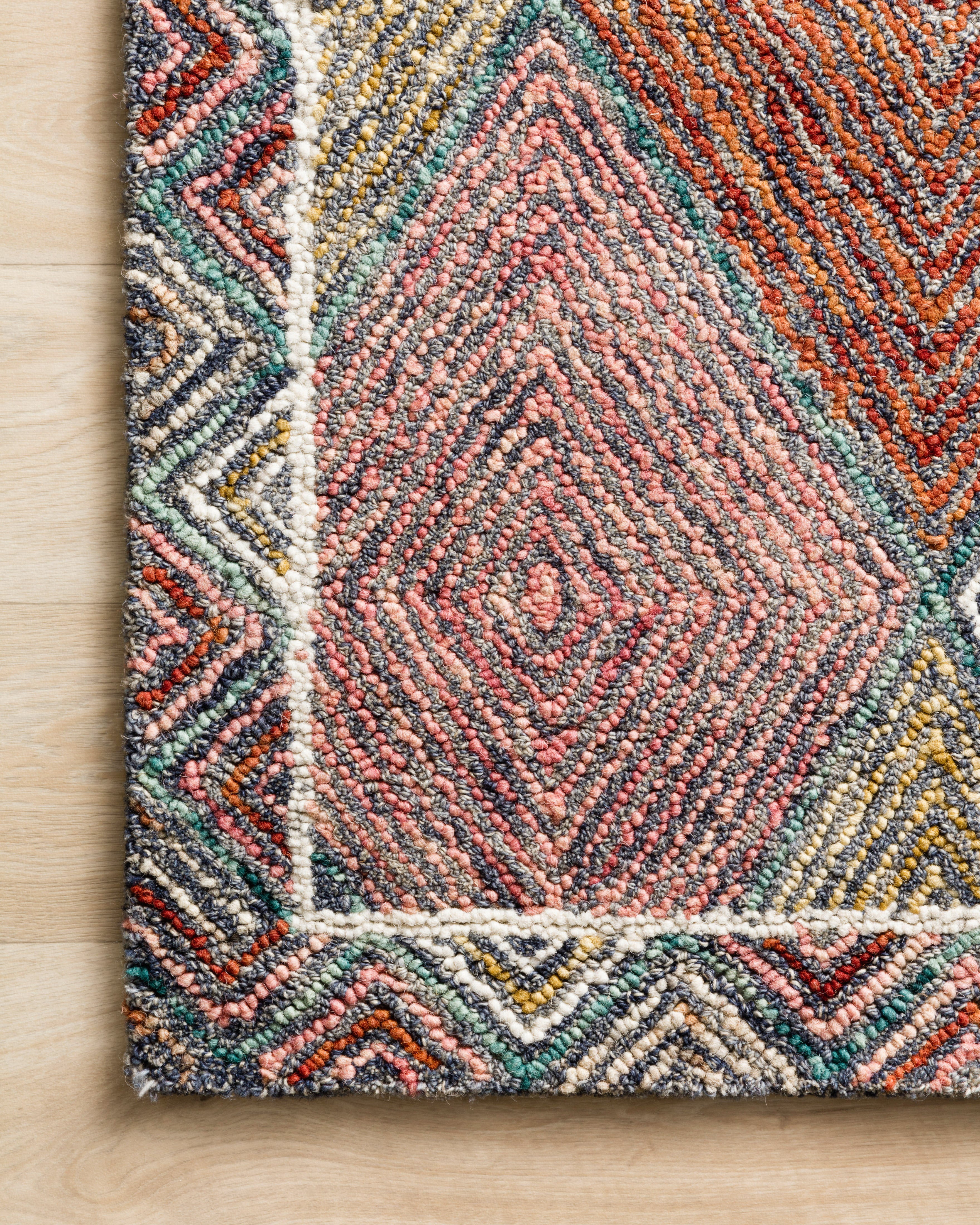 Expertly crafted as a hooked wool area rug with geometric and eclectic artistry, the Spectrum SPE-02 Turquoise / Fiesta Area Rug captures vivid turquoise and lively fiesta tones beautifully