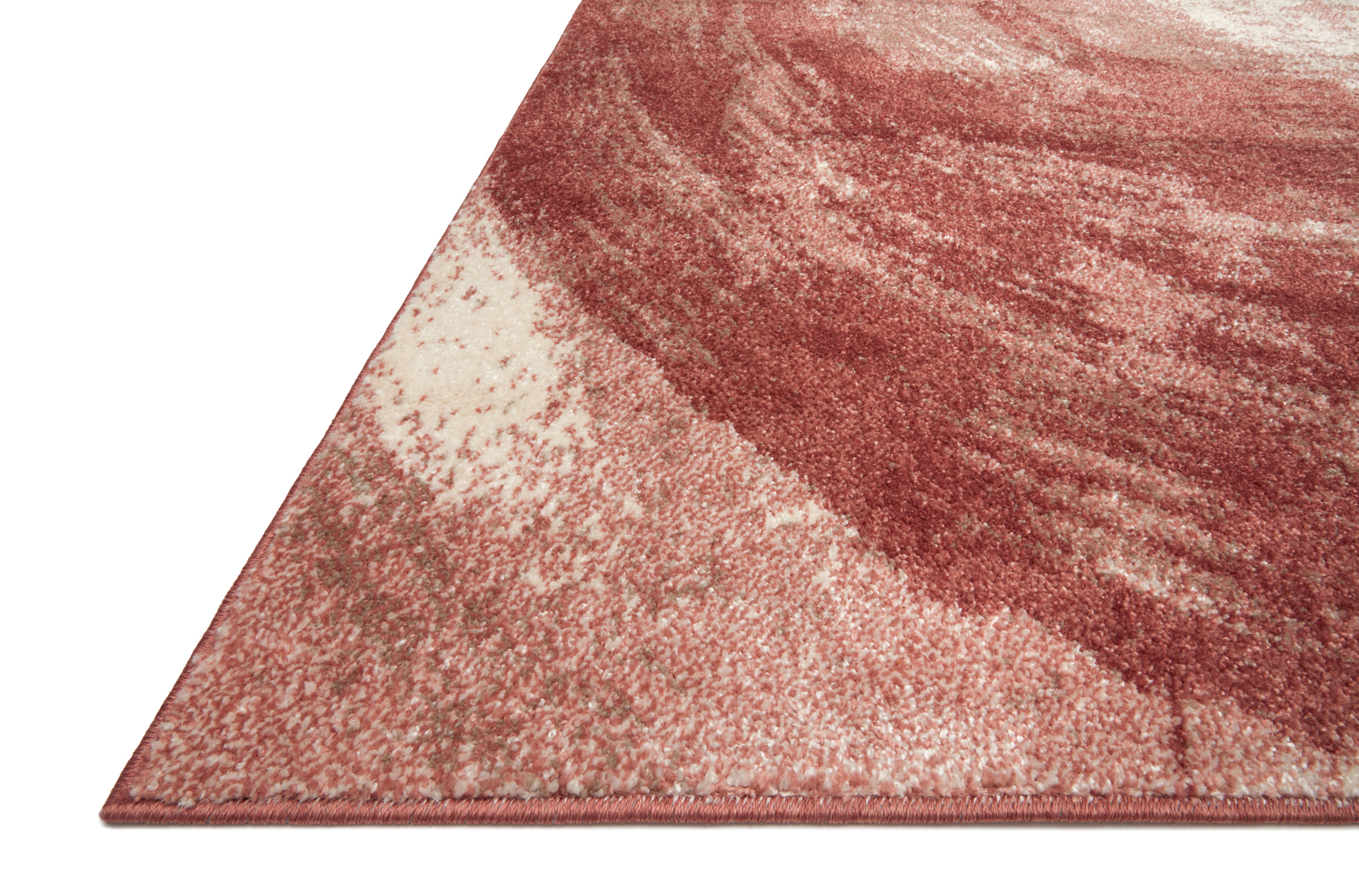 The Spirit SPI-03 Rose / Spice Area Rug highlights romantic rose and spirited spice tones and abstract texture in a beautifully made power-loomed 100% polypropylene area rug