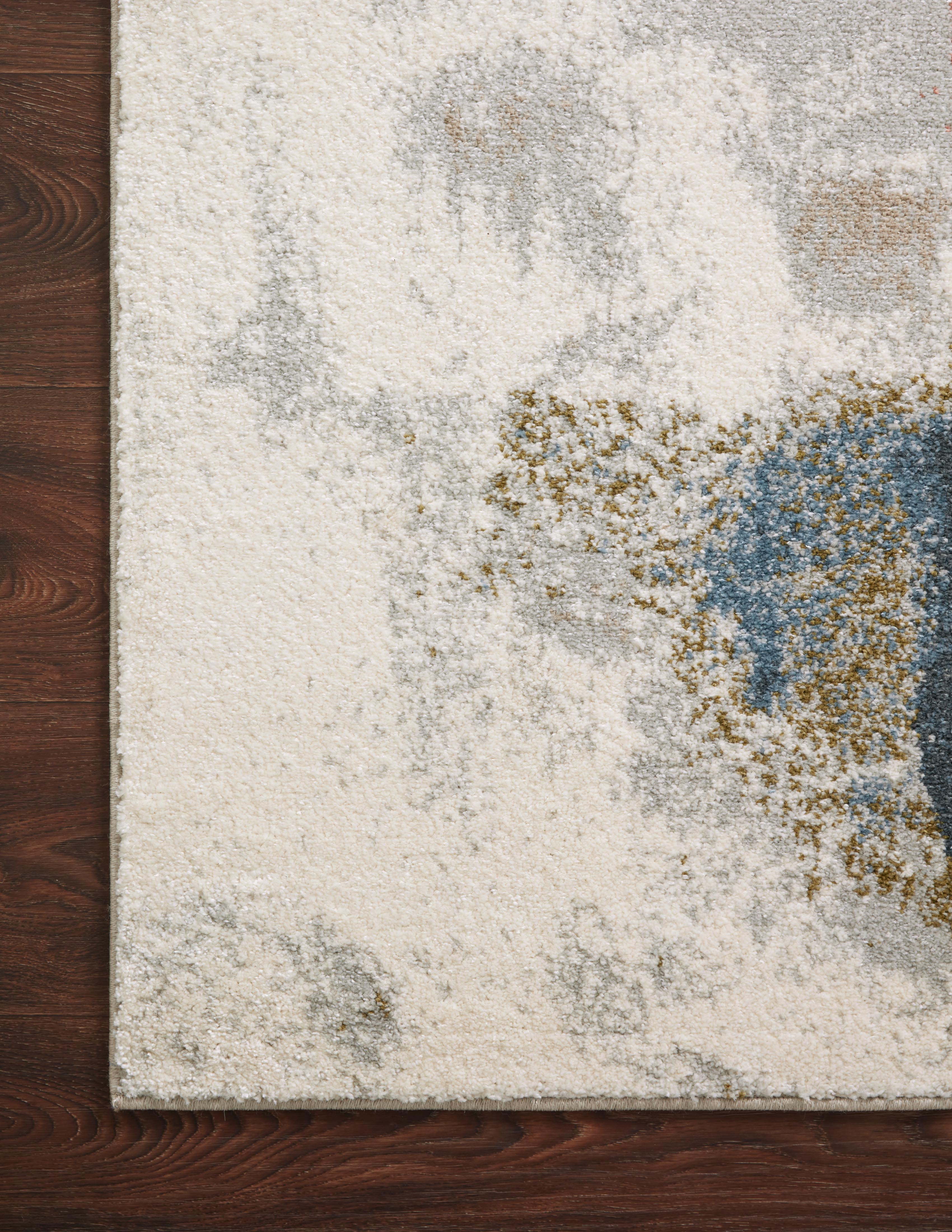 The Spirit SPI-05 Stone / Multi Area Rug transforms any space with grounding stone and vibrant multi-toned tones and abstract design in a power-loomed 100% polypropylene area rug