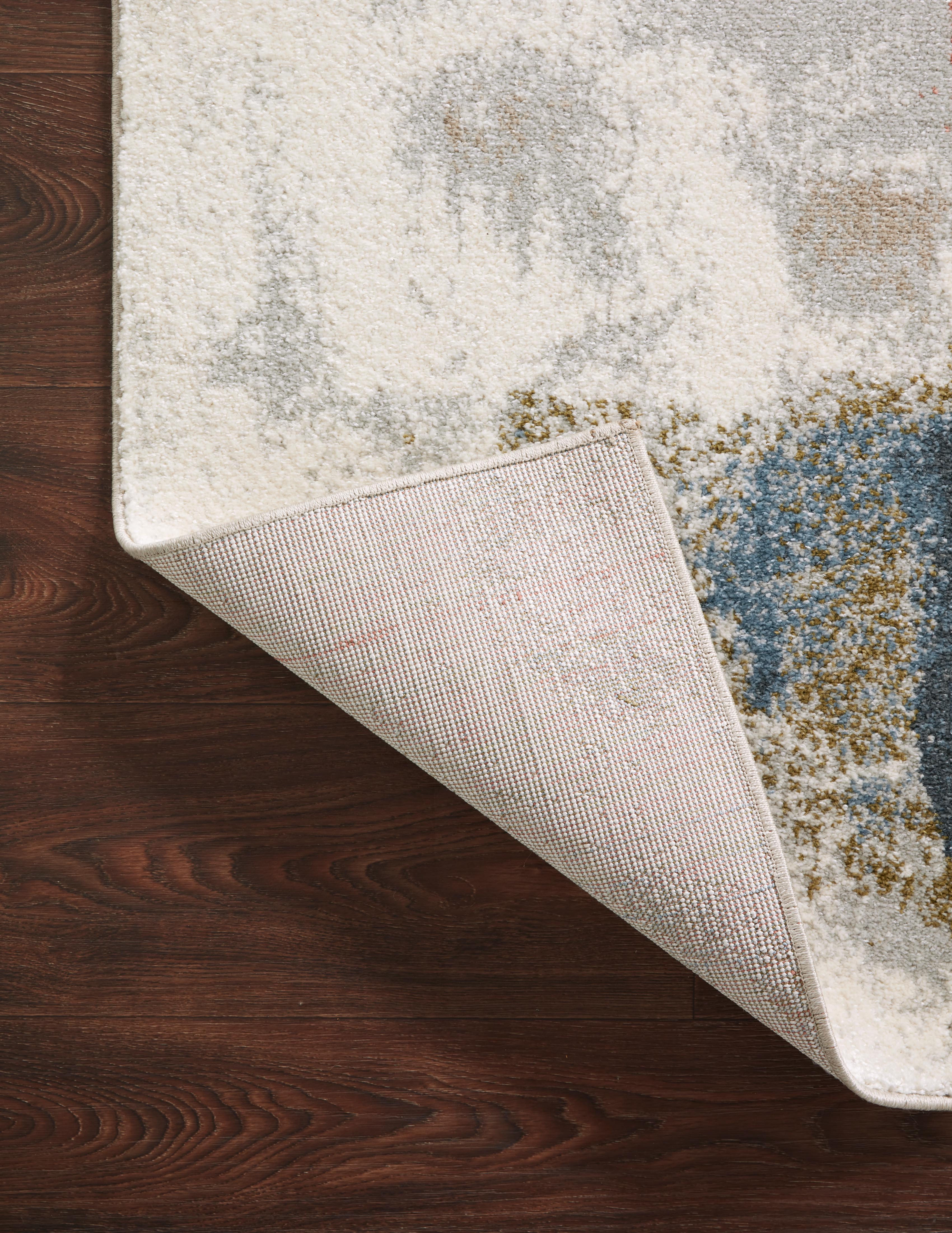 The Spirit SPI-05 Stone / Multi Area Rug transforms any space with grounding stone and vibrant multi-toned tones and abstract design in a power-loomed 100% polypropylene area rug