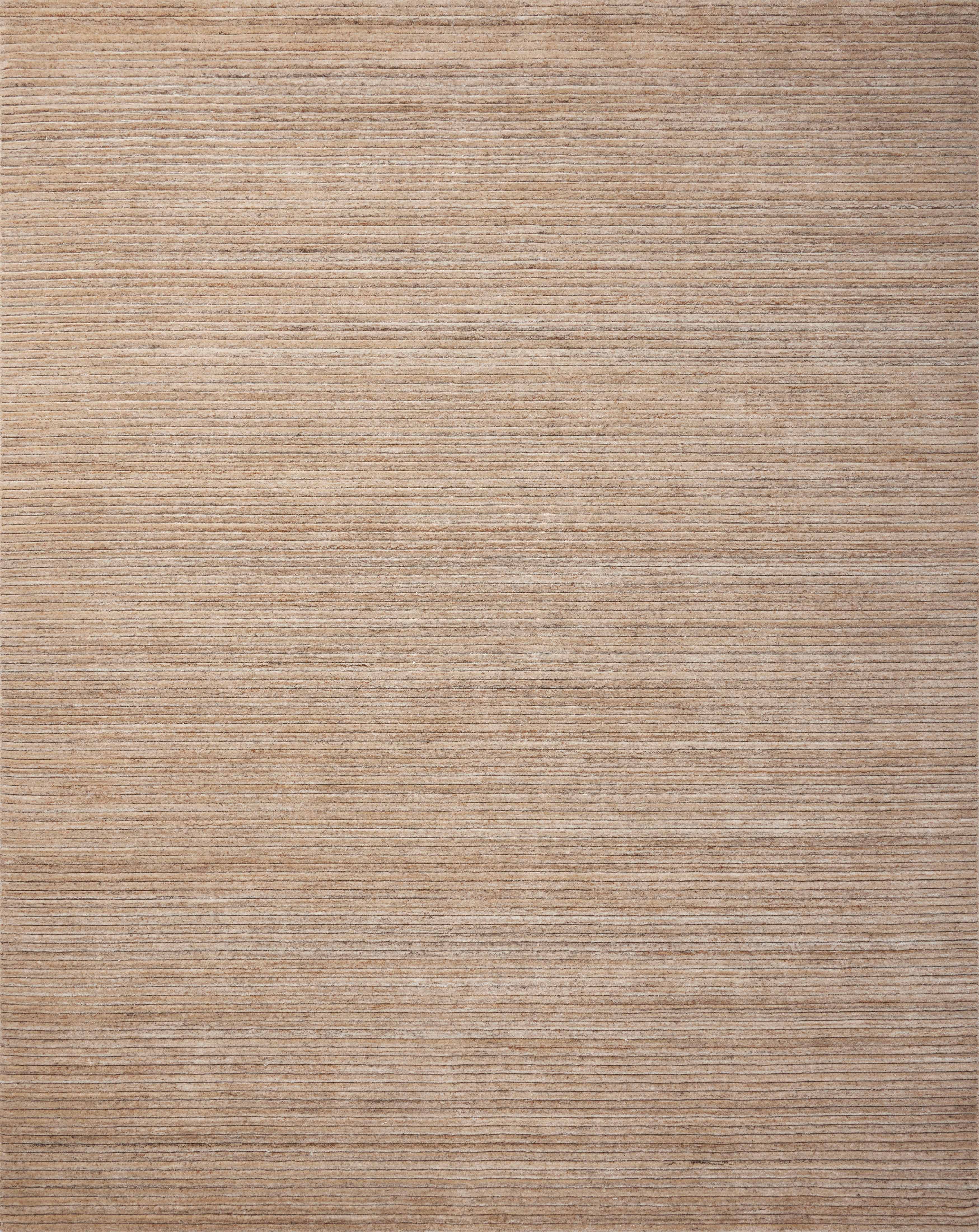 The Sterling STL-01 Natural Area Rug is a hand-loomed polyester area rug that radiates warm natural charm