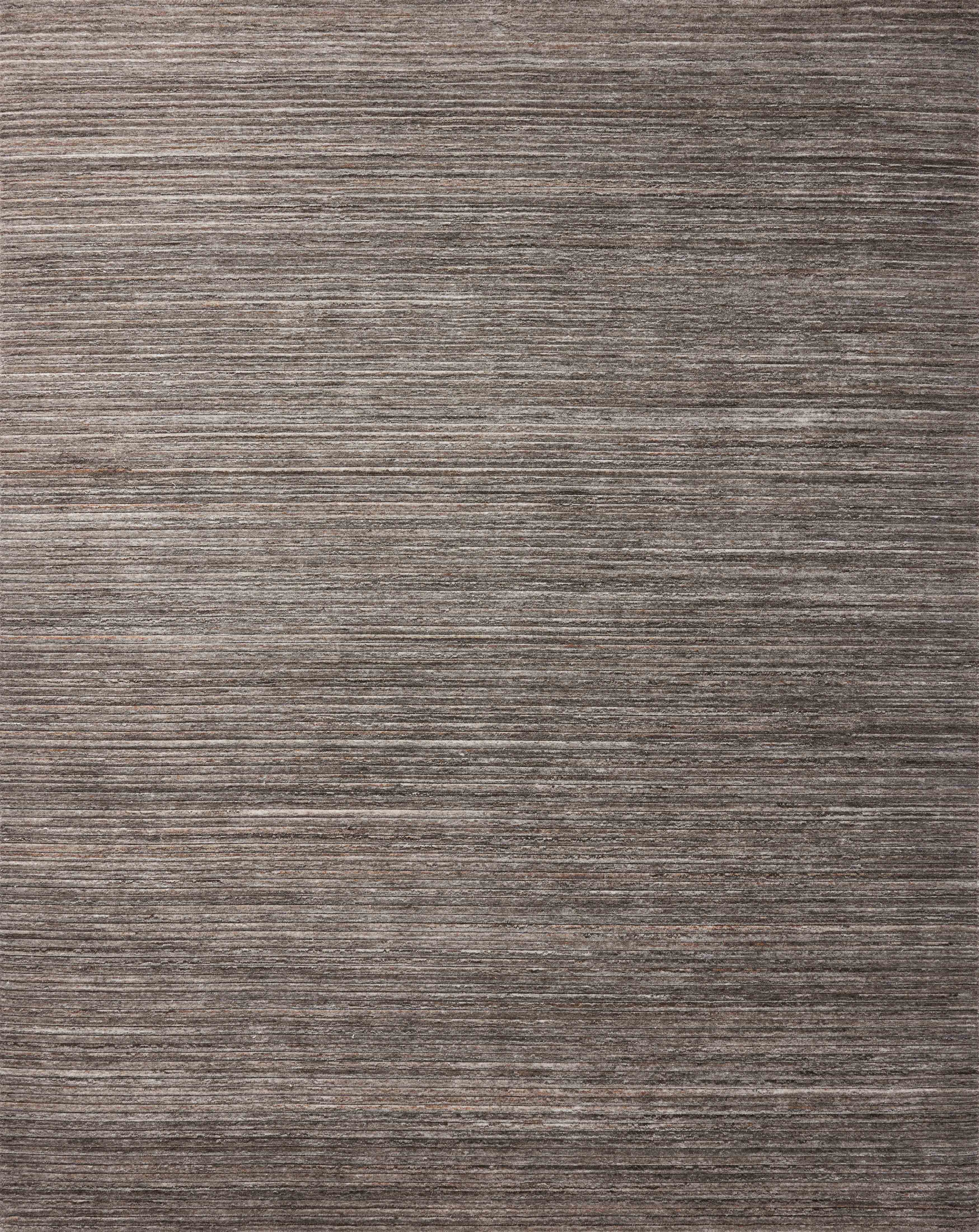 Layered in grounding stone hues, the Sterling STL-01 Stone Area Rug is a hand-loomed polyester area rug perfect for any setting