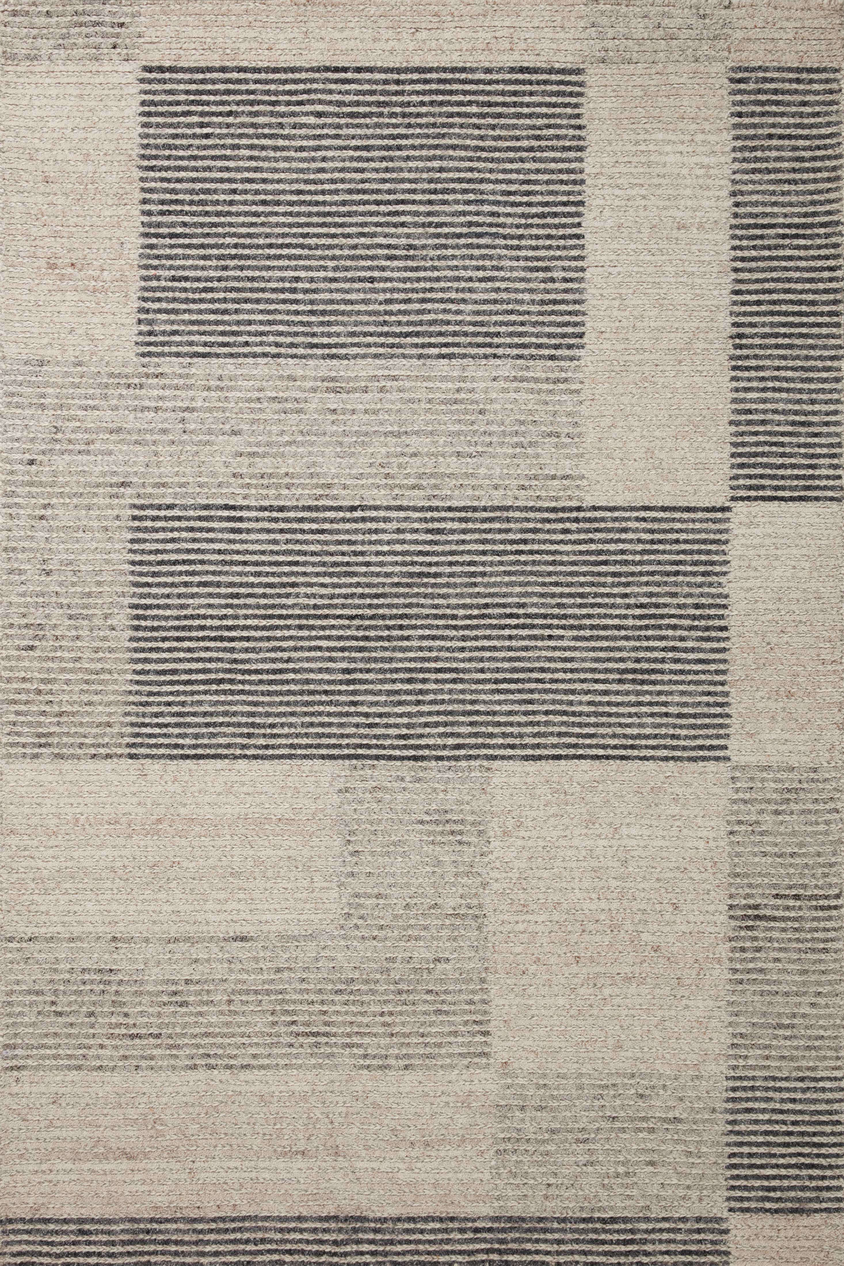The Stiles STI-01 Dove / Ink Area Rug is a hand-tufted 100% wool area rug that radiates gentle dove and bold ink charm and colorblock and ribbed elegance