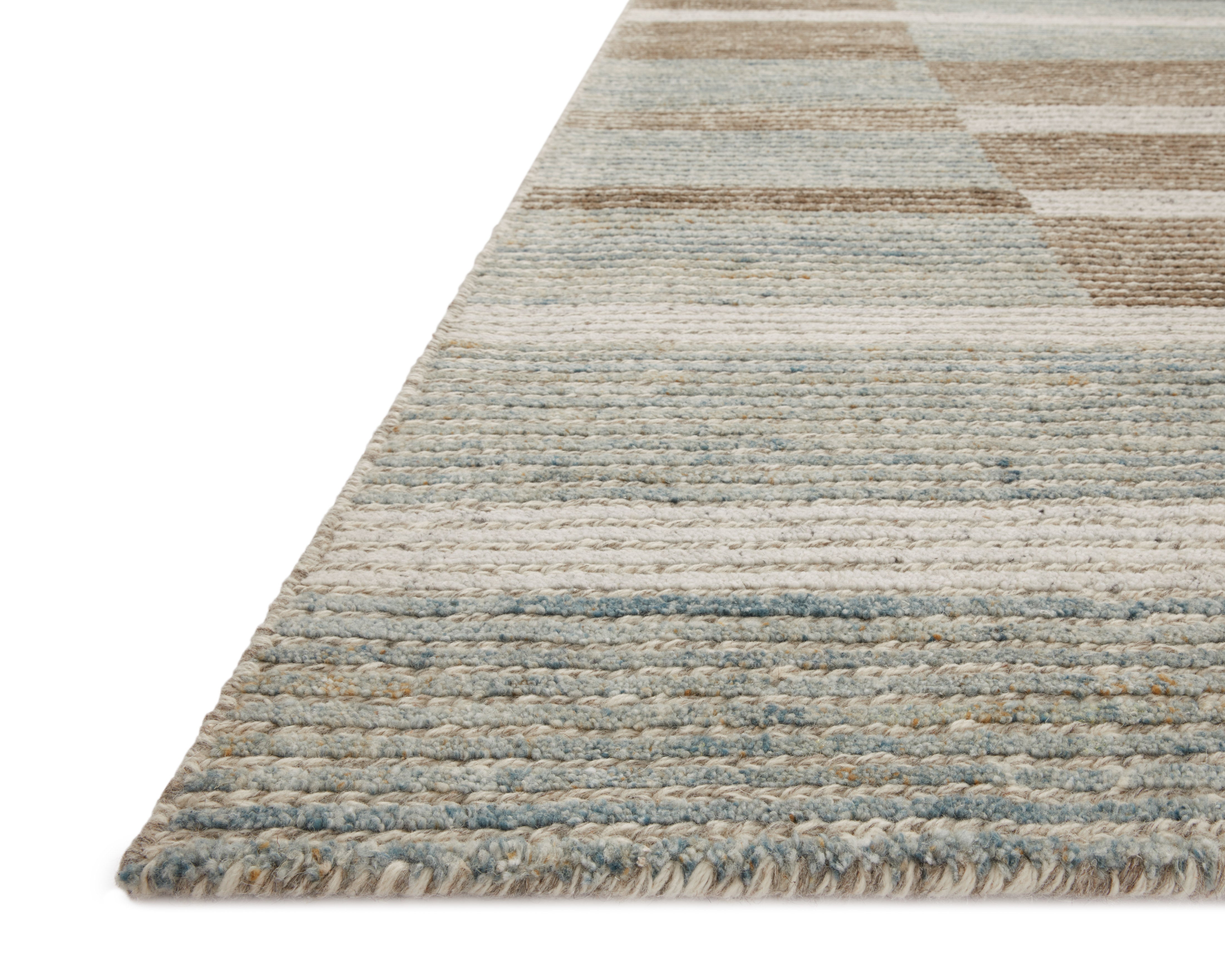 Layered in rich tobacco and tranquil lagoon hues with colorblock and ribbed patterns, the Stiles STI-02 Tobacco / Lagoon Area Rug is a hand-tufted 100% wool area rug perfect for any setting