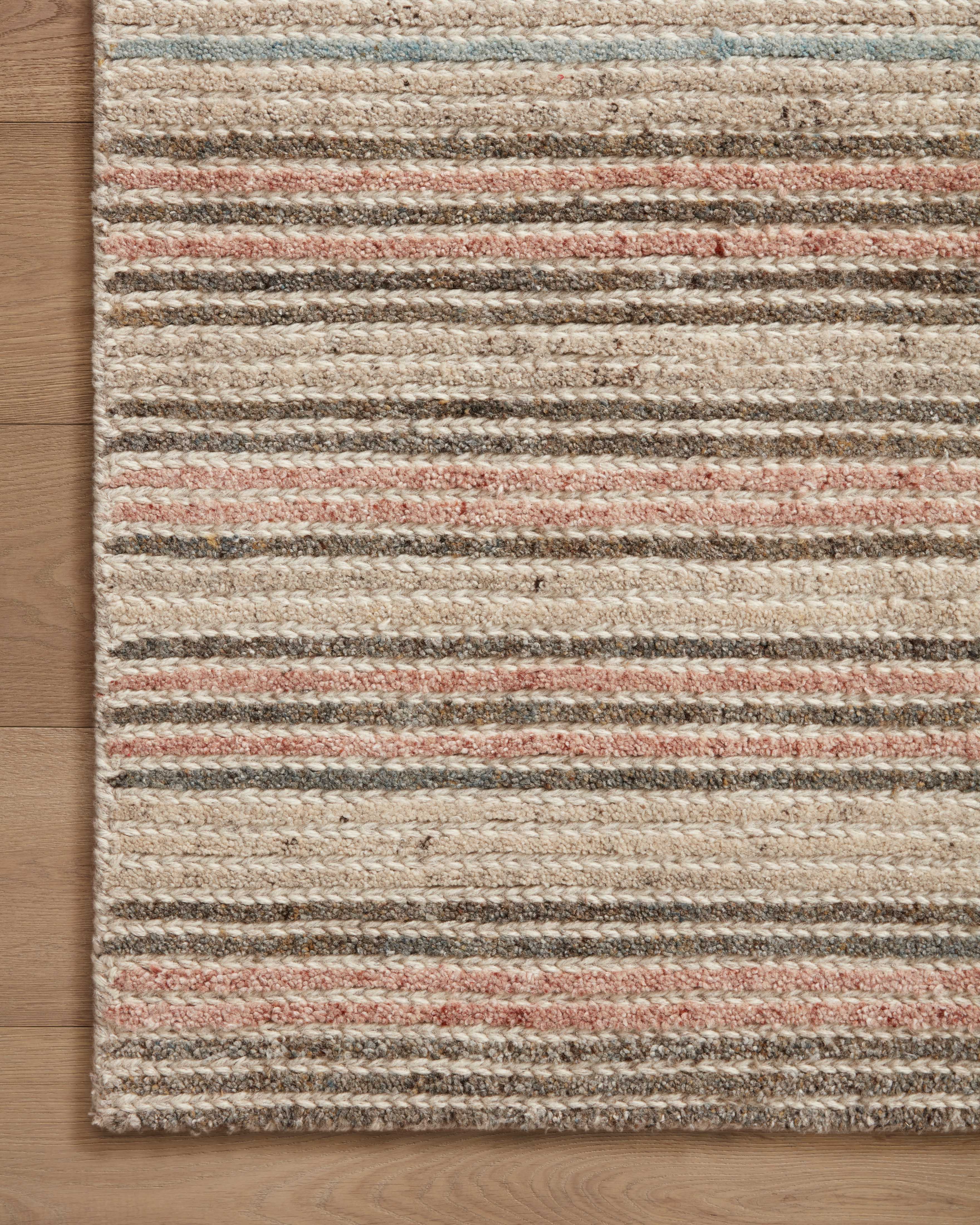 The Stiles STI-03 Beige / Multi Area Rug showcases warm beige and vibrant multi-toned tones in a hand-tufted 100% wool area rug with colorblock and ribbed style