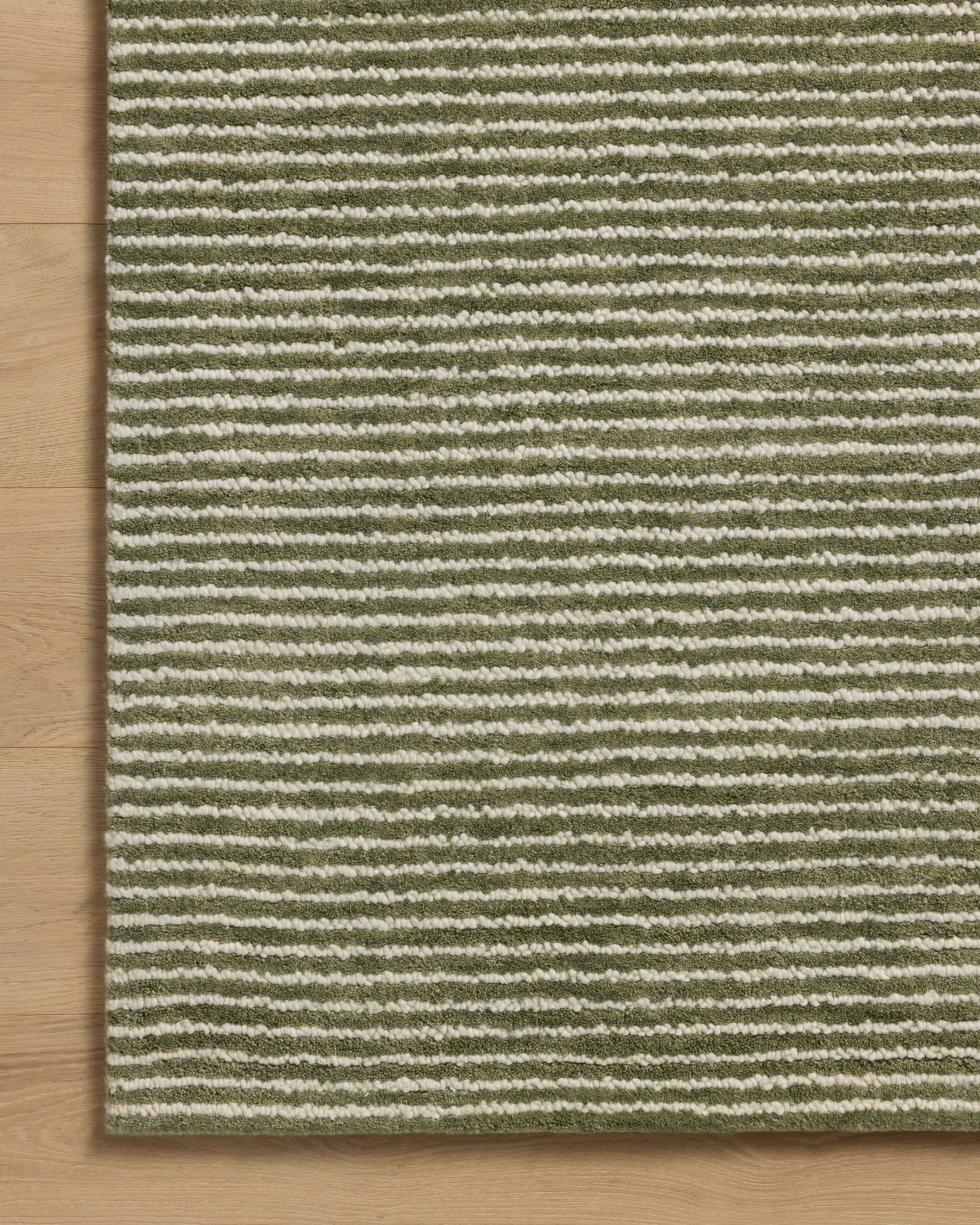 A stunning hand-tufted wool area rug, the Sunday SUN-01 Olive / Ivory Area Rug features earthy olive and refined ivory tones for a polished look