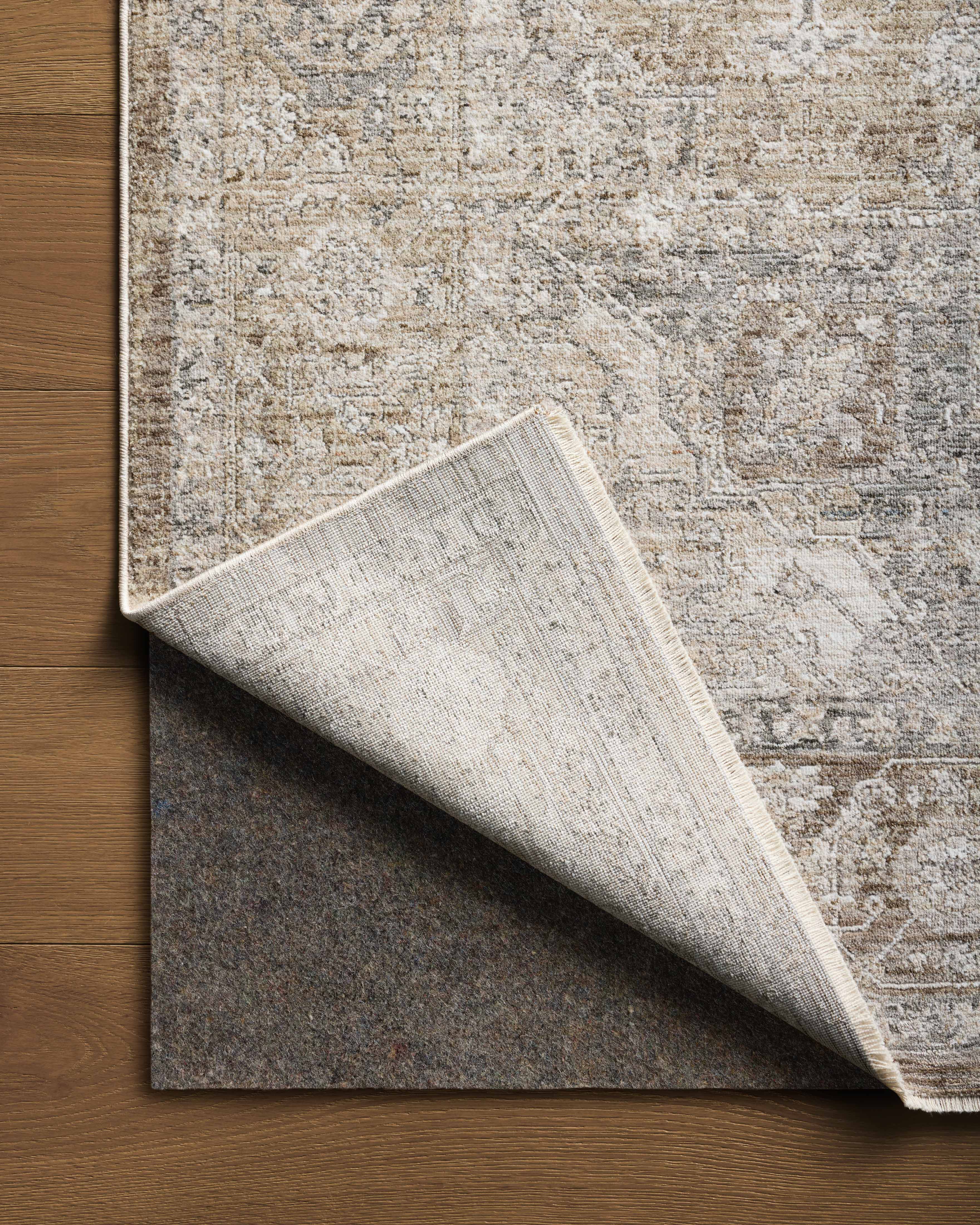 The Tabitha TAI-01 Khaki / Slate Area Rug showcases khaki and cool slate tones in a power-loomed polyester area rug with traditional style