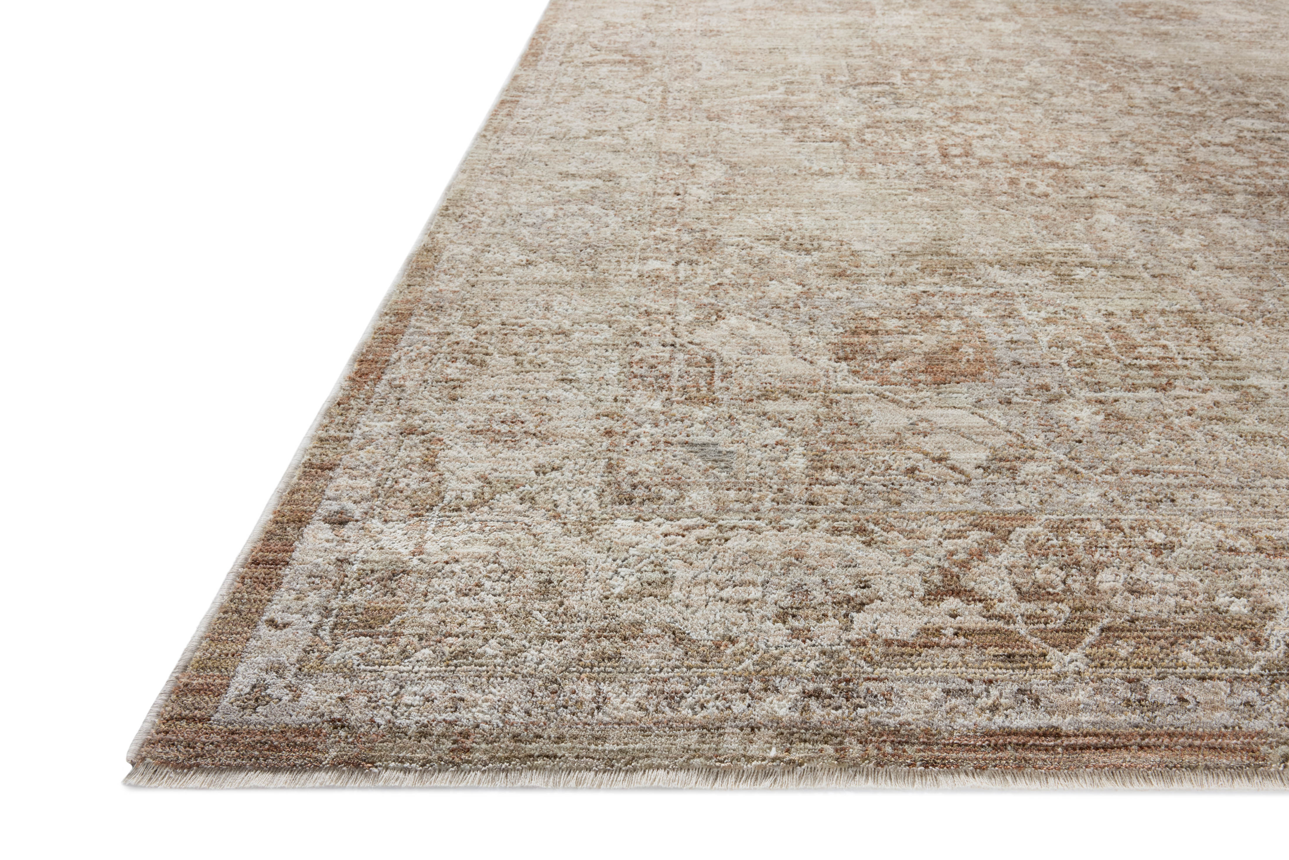 Featuring warm natural and earthy clay hues and traditional detail, the Tabitha TAI-01 Natural / Clay Area Rug is a power-loomed polyester area rug for any room