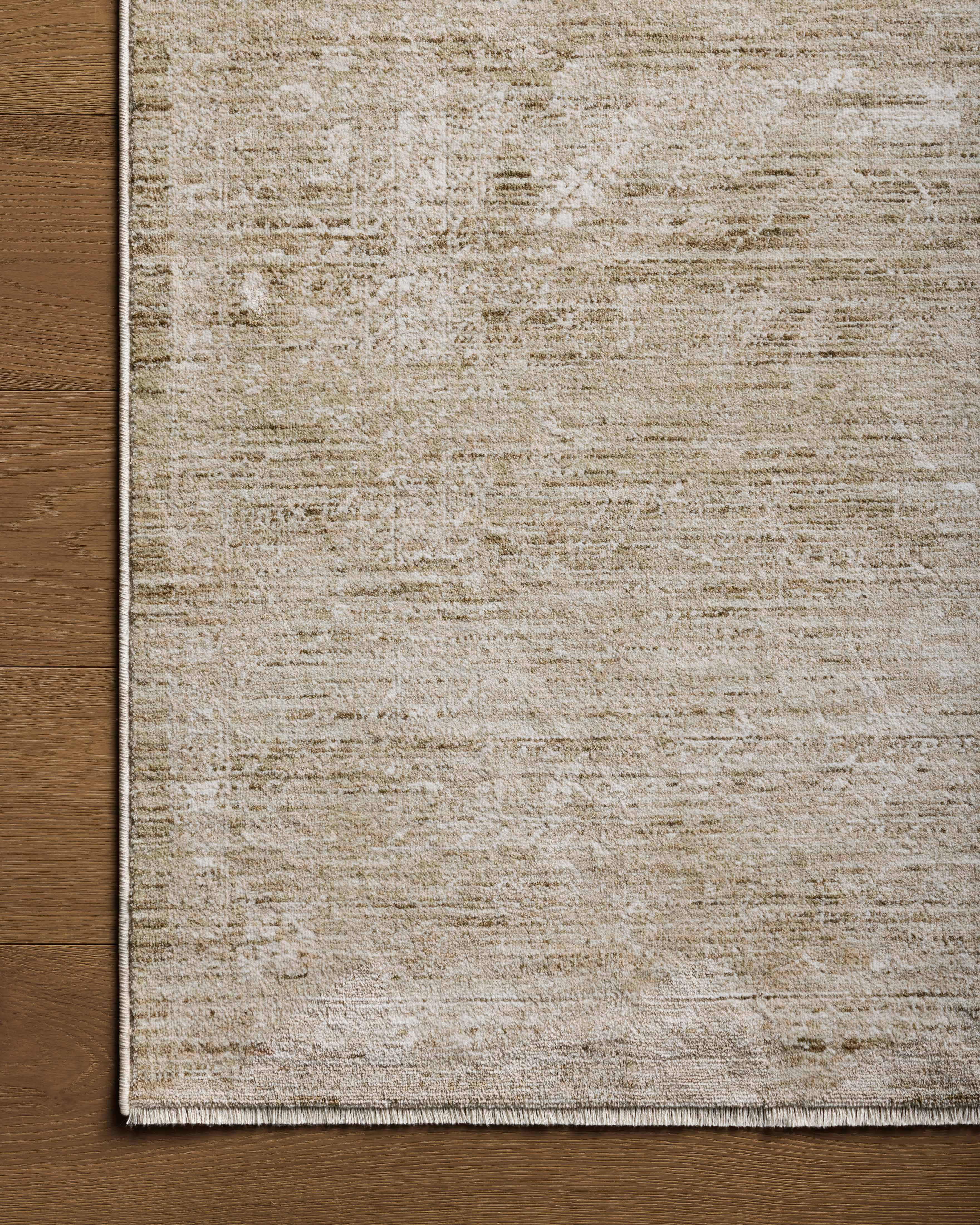 A power-loomed polyester area rug with traditional flair in calming sage and refined ivory tones, the Tabitha TAI-02 Sage / Ivory Area Rug anchors any room