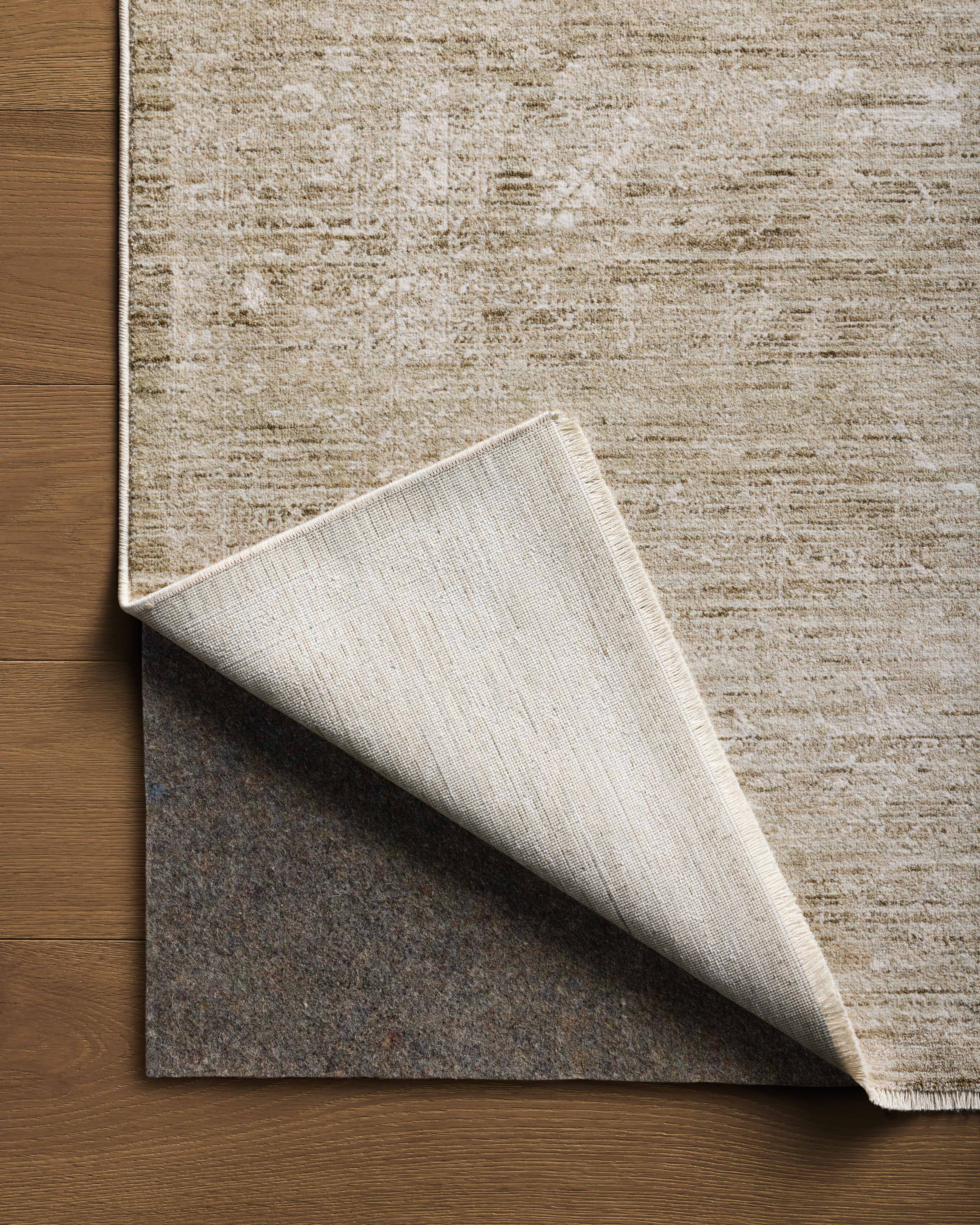 A power-loomed polyester area rug with traditional flair in calming sage and refined ivory tones, the Tabitha TAI-02 Sage / Ivory Area Rug anchors any room