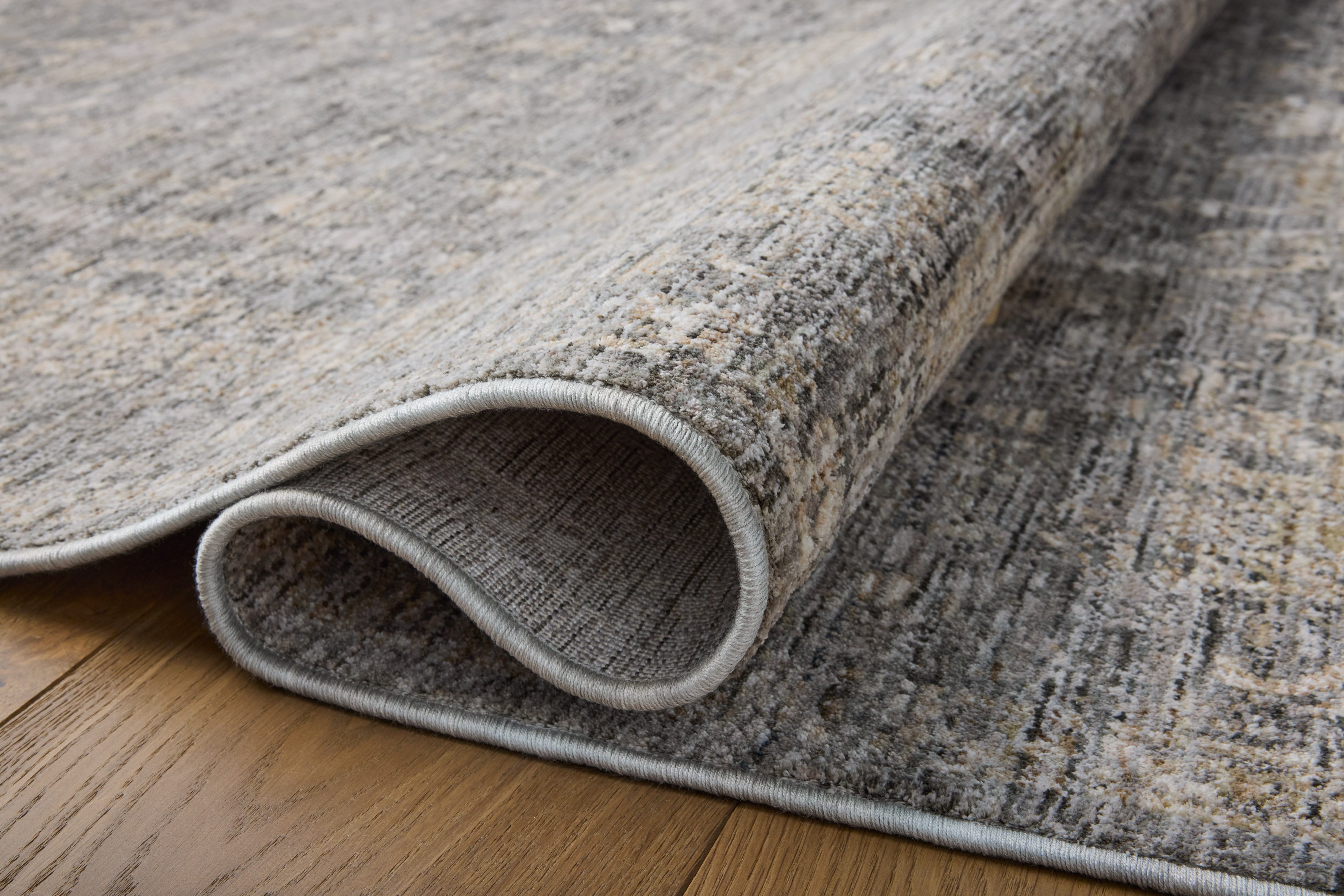 The Tabitha TAI-02 Stone / Natural Area Rug pairs grounding stone and warm natural tones and traditional patterns in a power-loomed polyester area rug