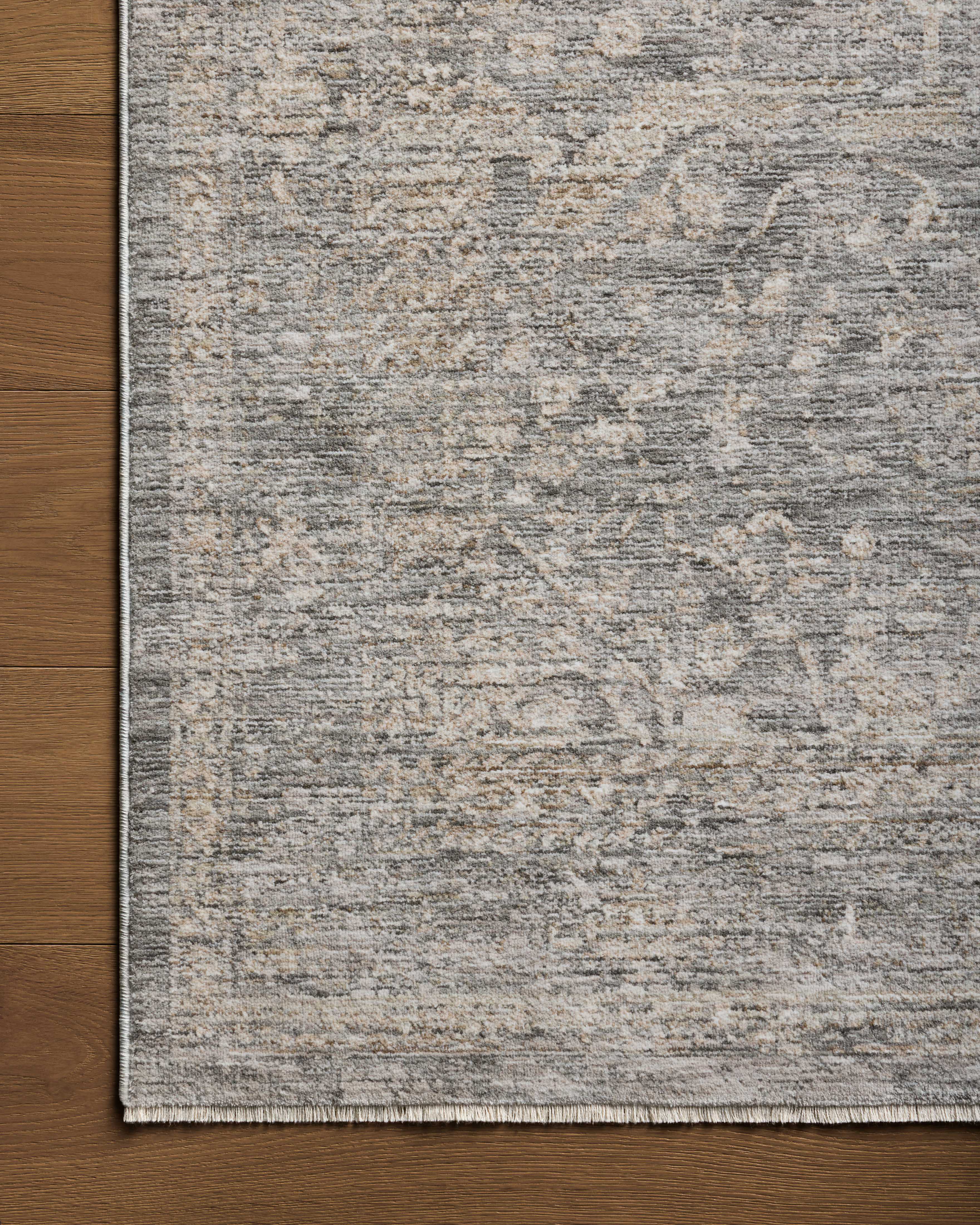 The Tabitha TAI-02 Stone / Natural Area Rug pairs grounding stone and warm natural tones and traditional patterns in a power-loomed polyester area rug