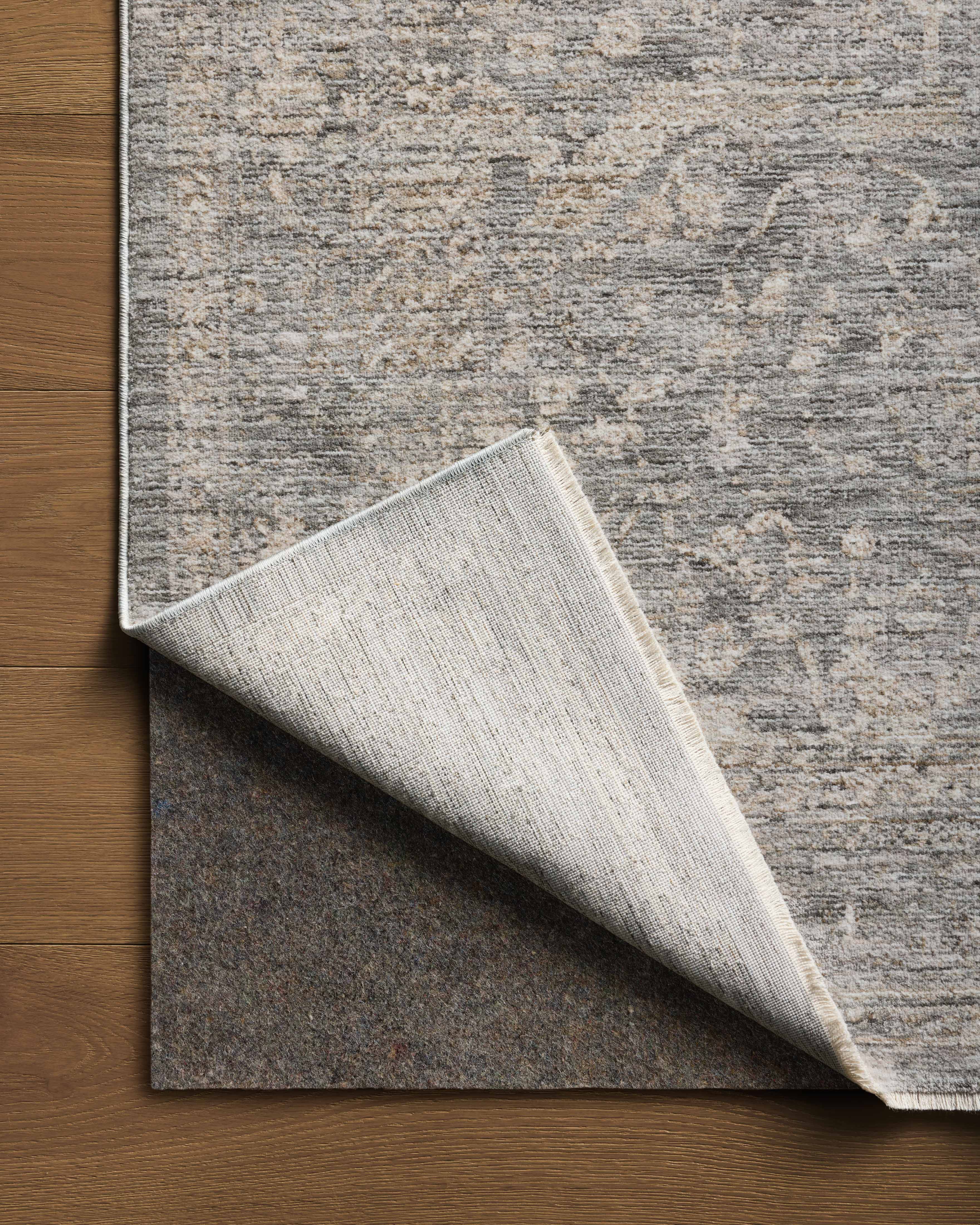 The Tabitha TAI-02 Stone / Natural Area Rug pairs grounding stone and warm natural tones and traditional patterns in a power-loomed polyester area rug