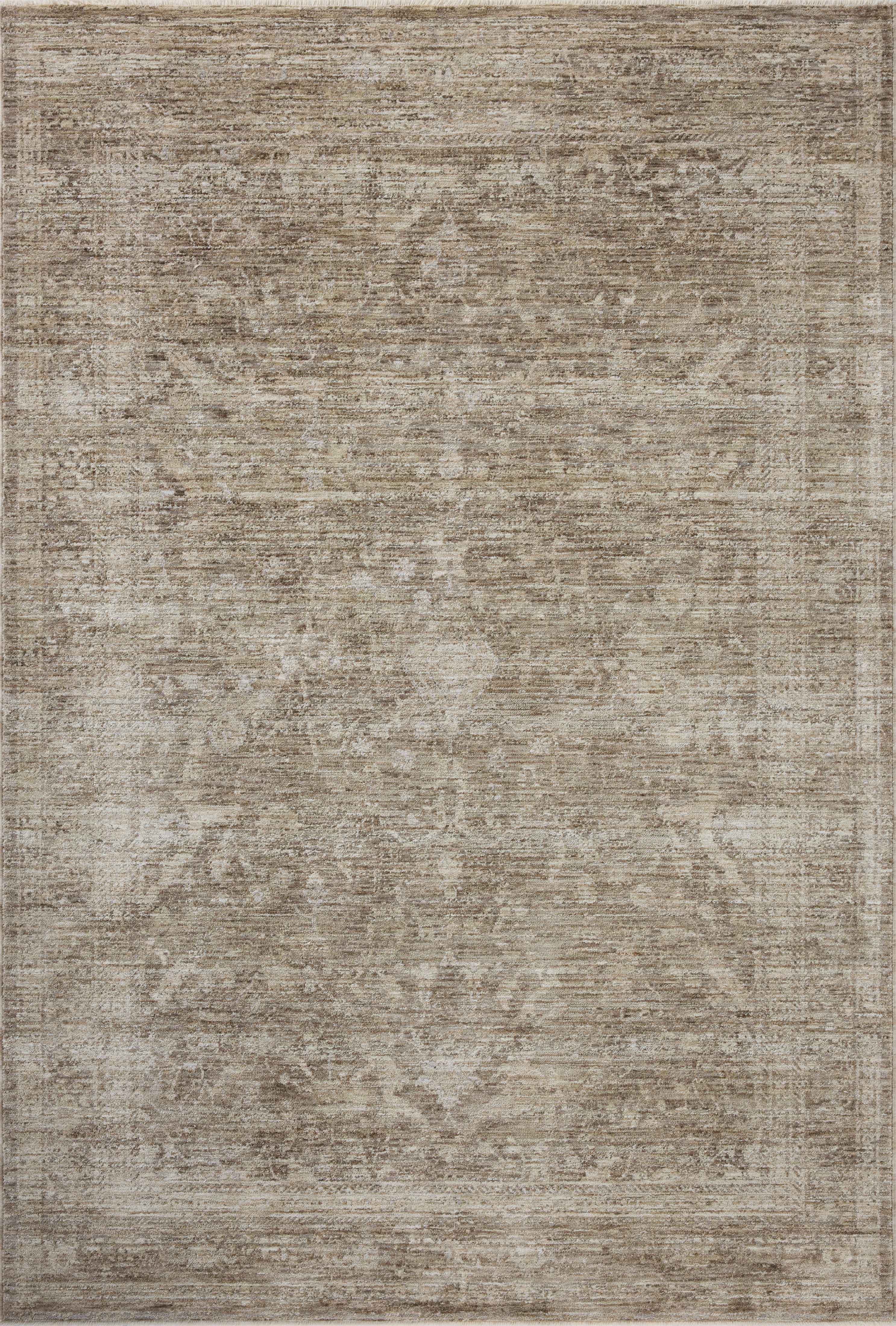 Crafted as a power-loomed polyester area rug, the Tabitha TAI-02 Taupe / Pebble Area Rug brings versatile taupe and subtle pebble warmth and traditional character to your space