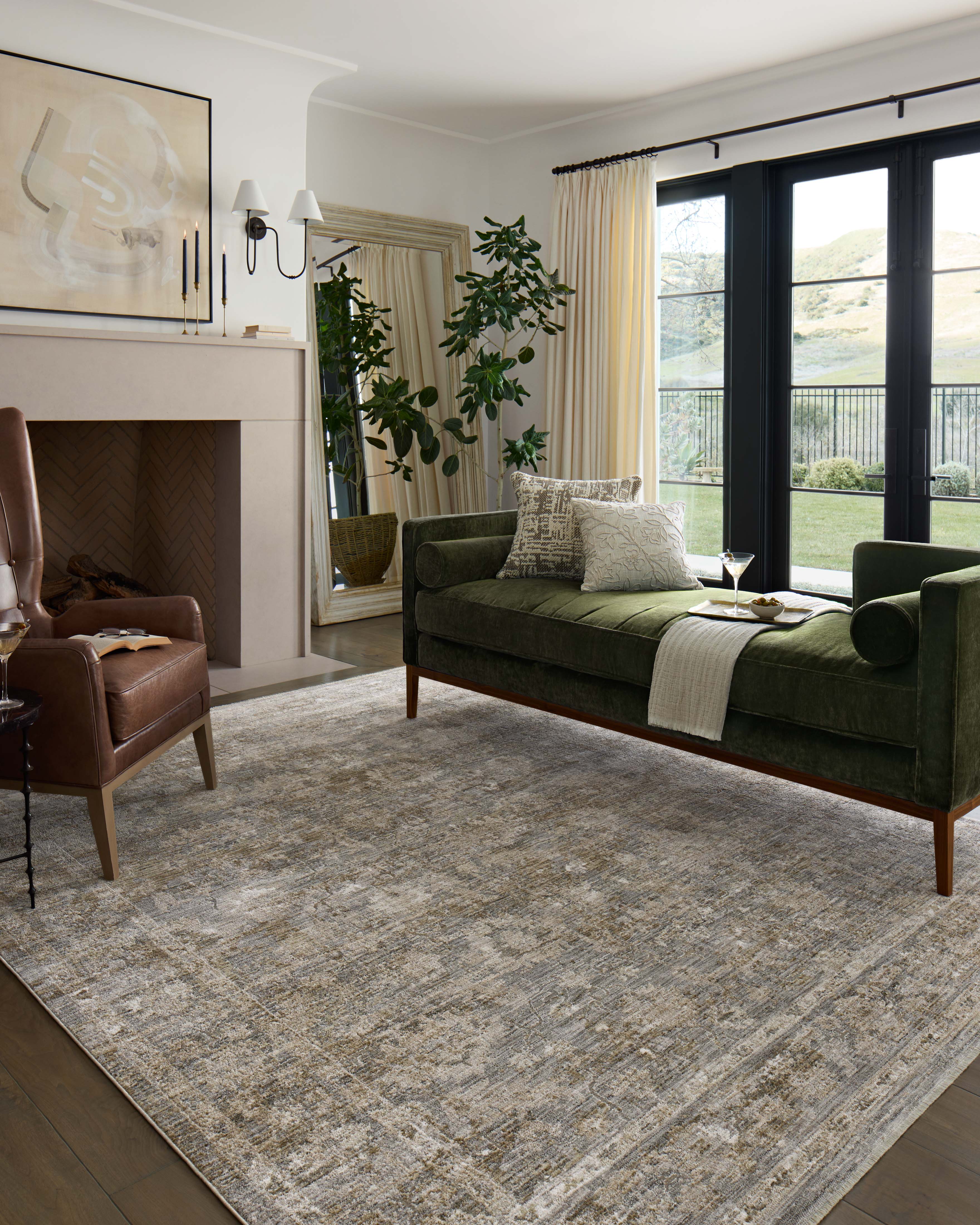 The Tabitha TAI-04 Slate / Natural Area Rug blends cool slate and warm natural tones and traditional motifs into a power-loomed polyester area rug with timeless appeal